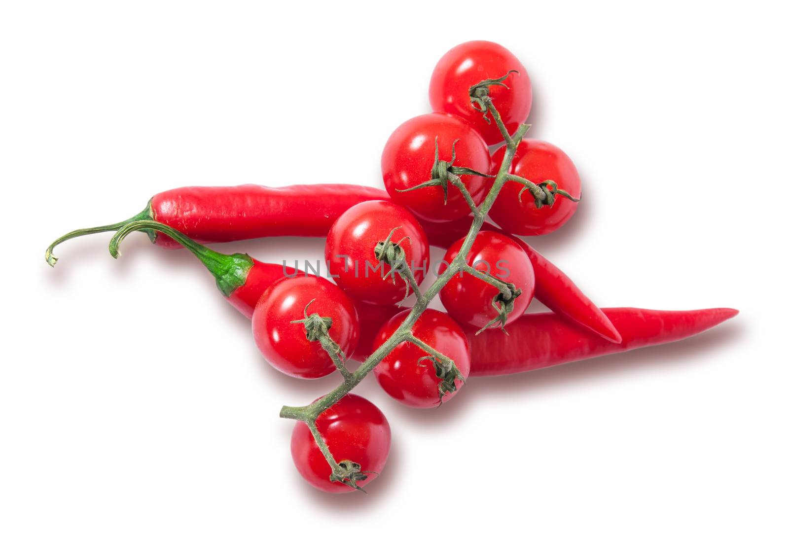 Branch of cherry tomatoes and two red chili peppers by Cipariss