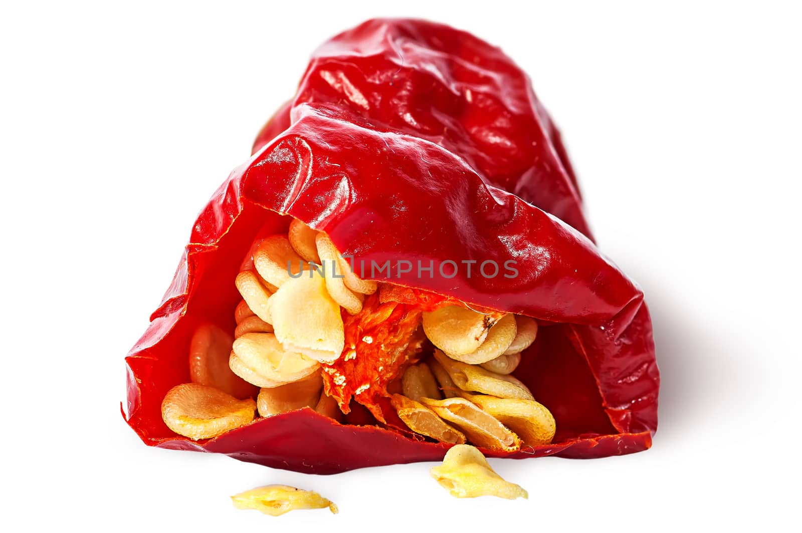 Closeup piece red hot chili pepper with seeds isolated on white background