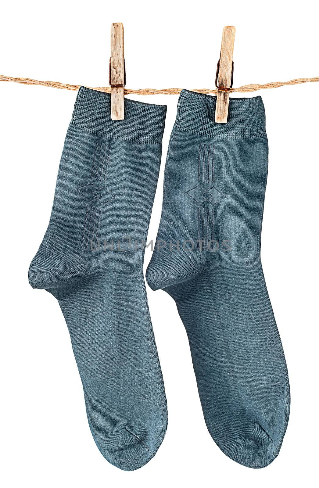 Dark blue socks on rope with clothespins isolated on white background