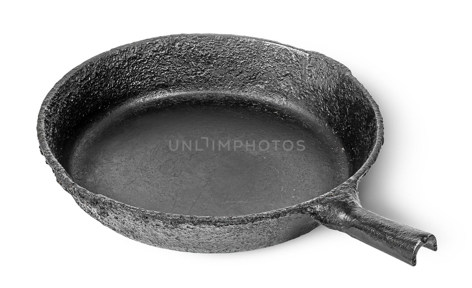 Empty old cast iron frying pan rotated by Cipariss