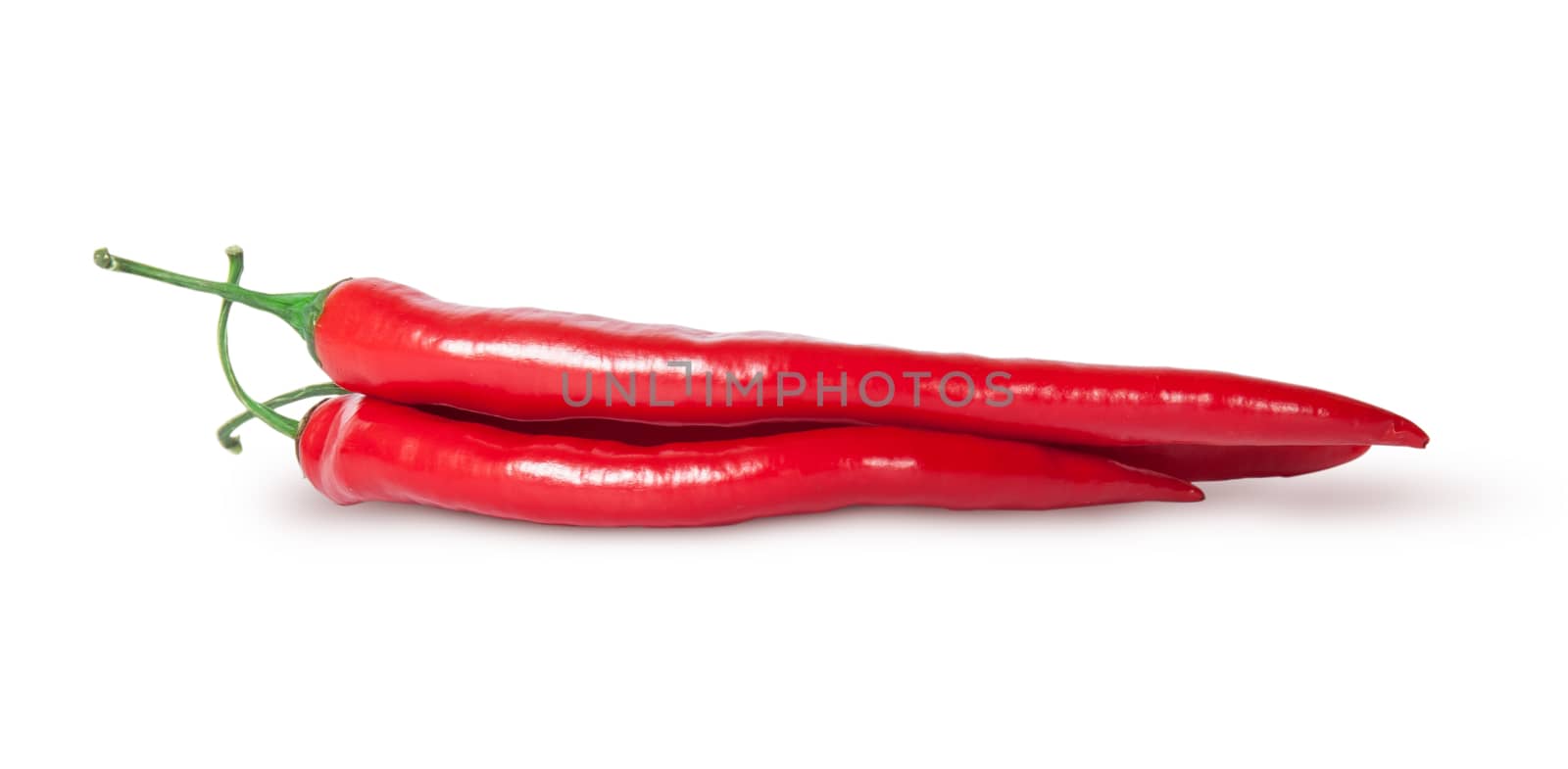 Heap of red chilli peppers isolated on white background