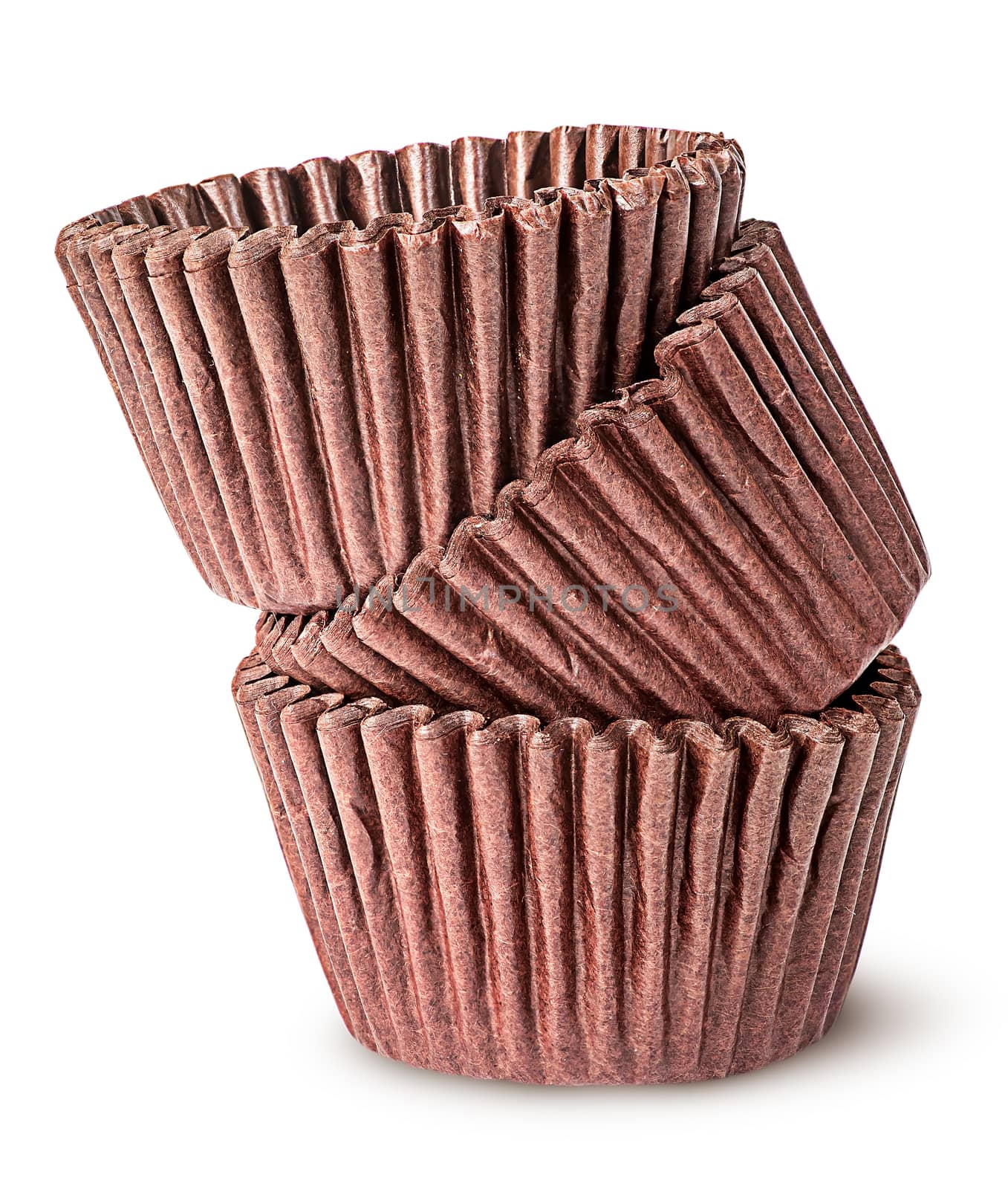 Heap of brown paper cups for baking muffins isolated on white background