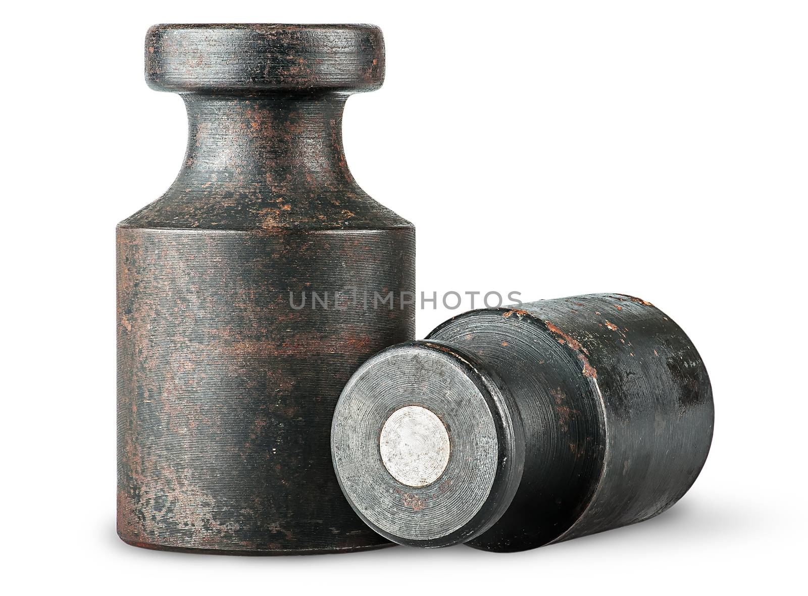 Lying and standing old rusty weights isolated on white background