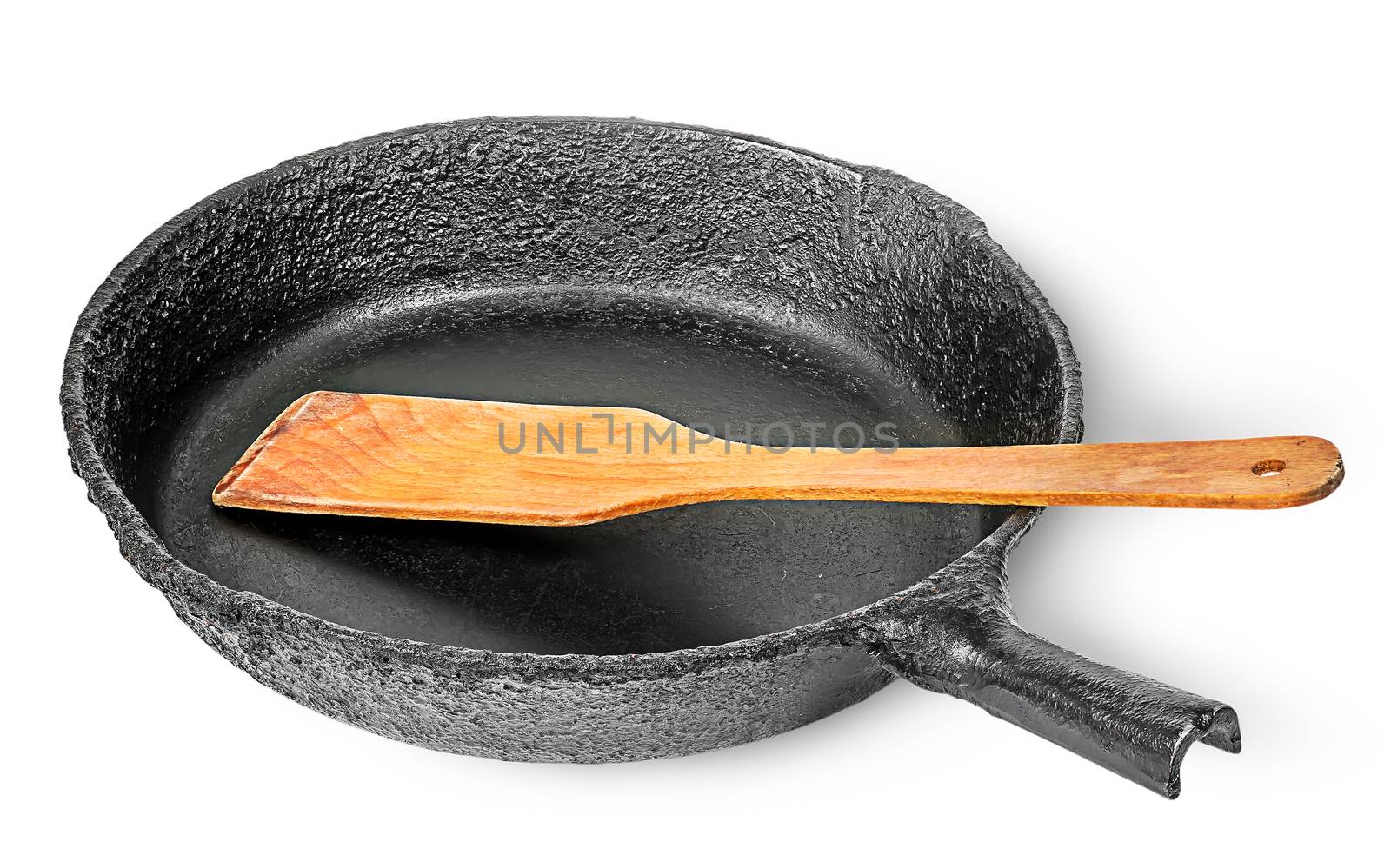 Old cast iron pan with wooden spatula by Cipariss