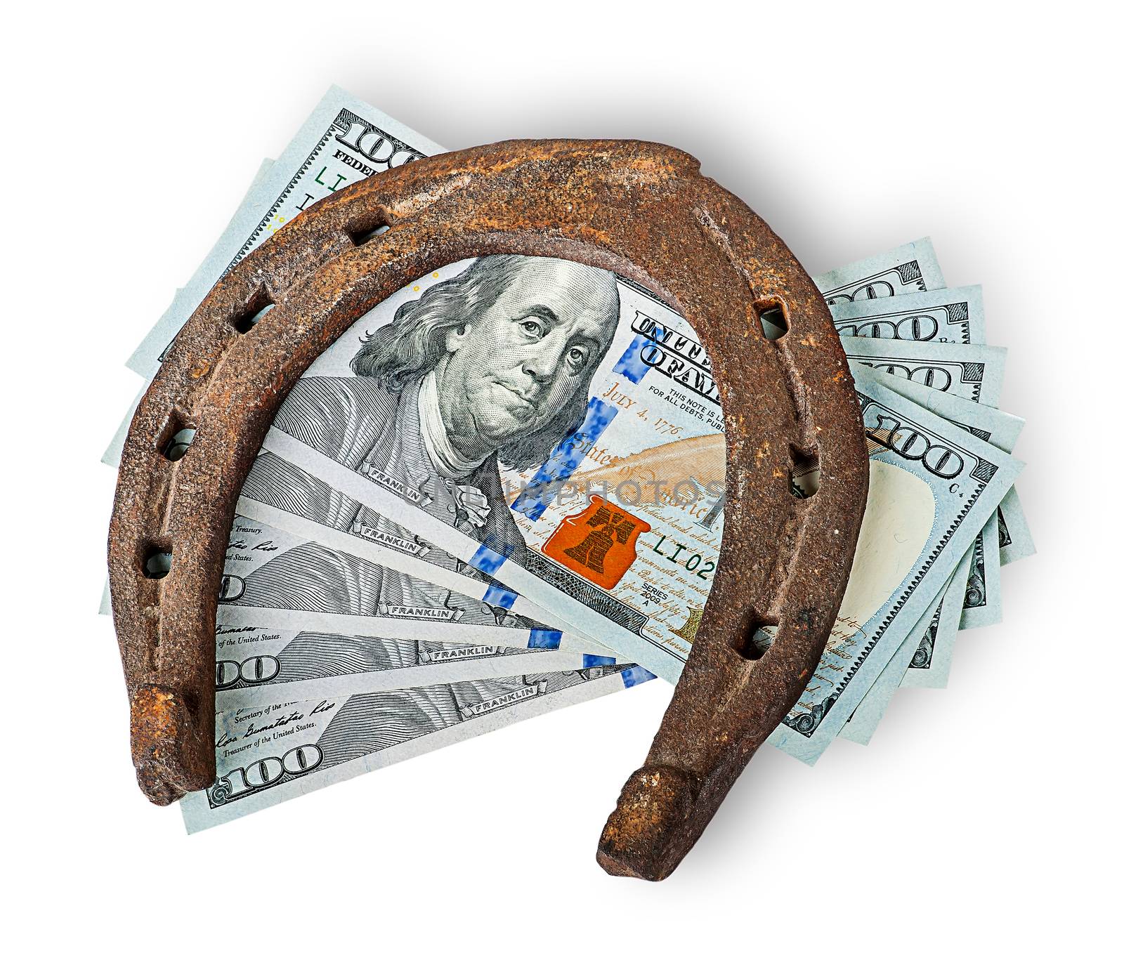 Old rusty horseshoe and money isolated on white background