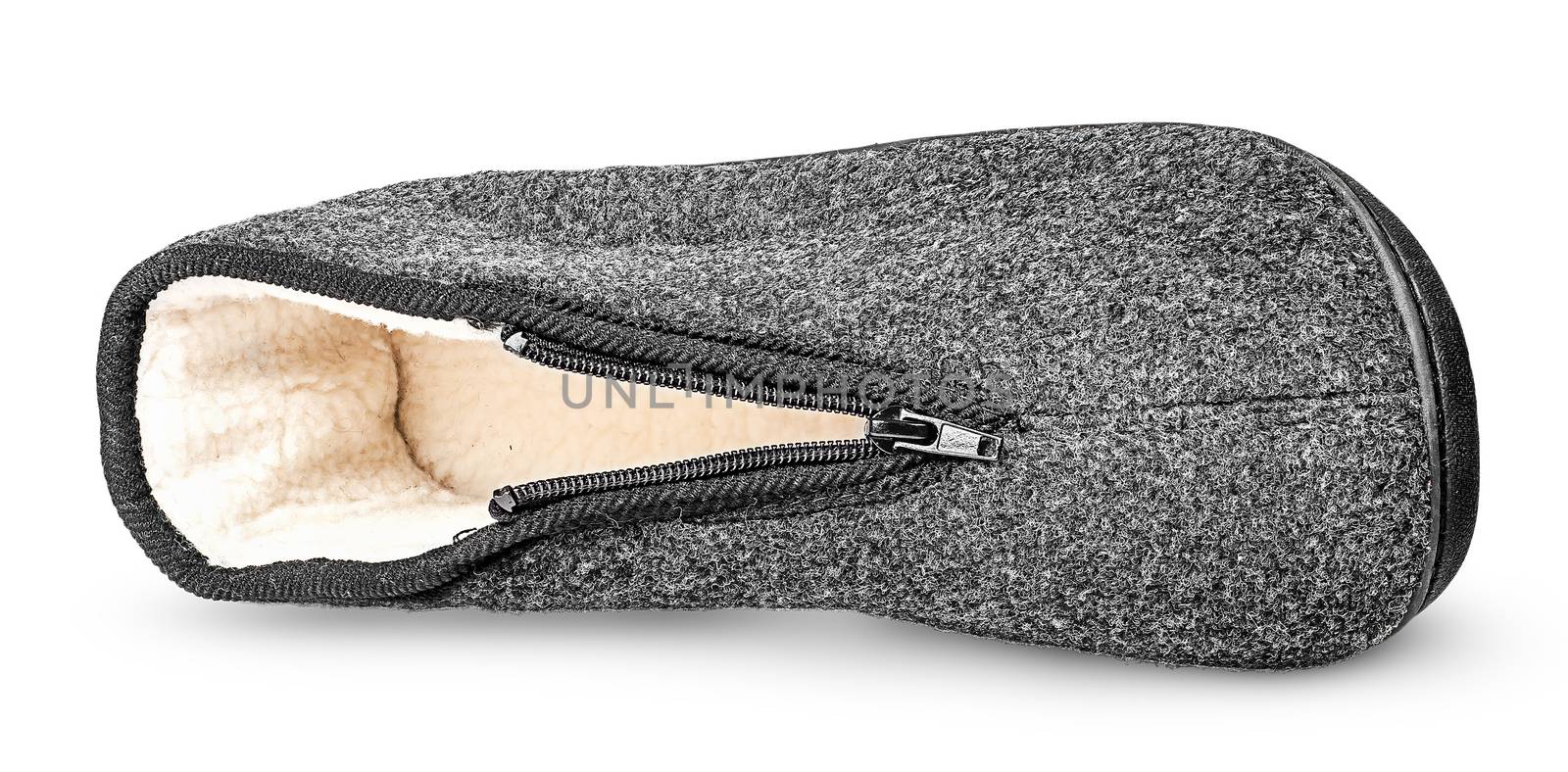 One piece the comfortable dark gray slipper lying on the side isolated on white background