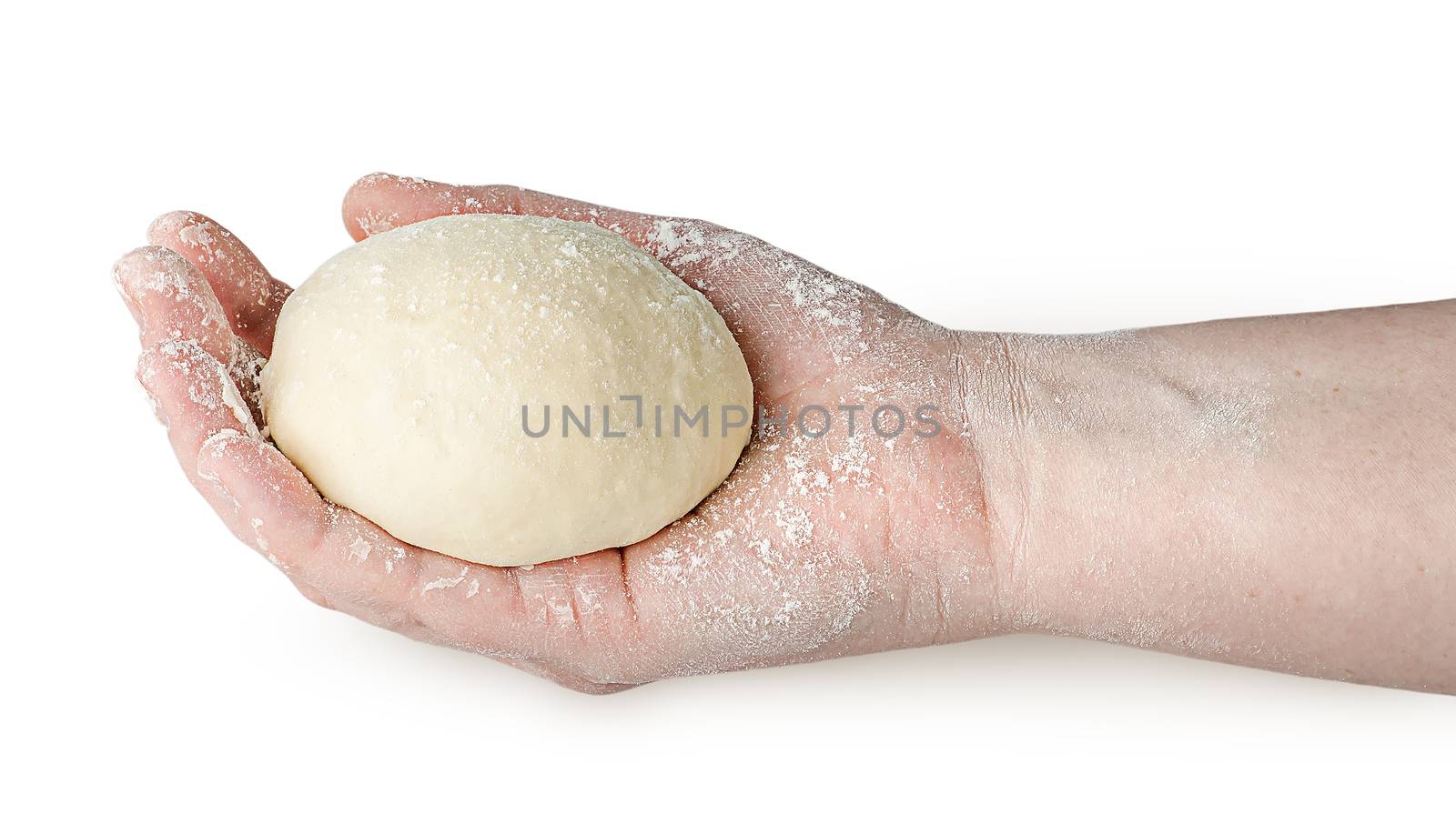 Piece of dough in human hand isolated on white background