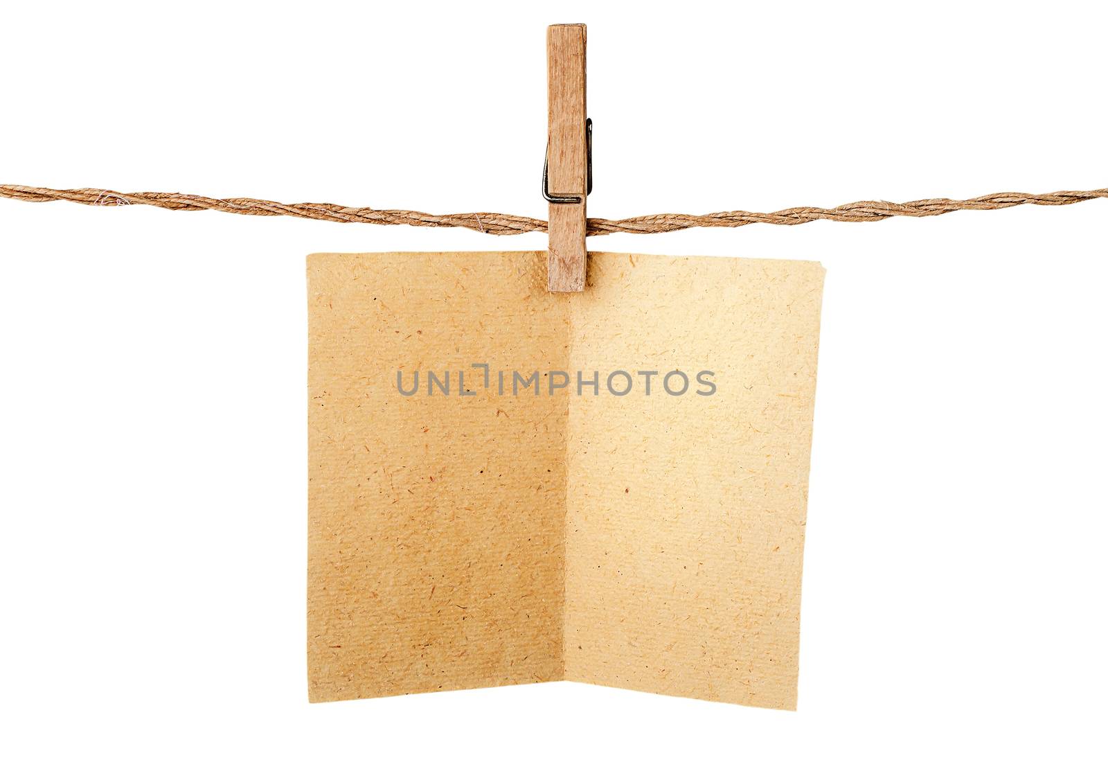 Piece old sheet of paper on clothespins isolated on white background