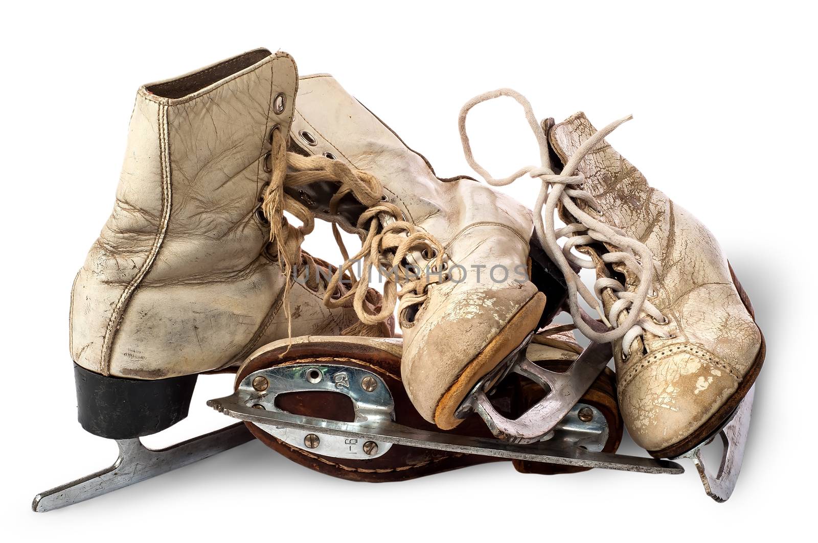 Pile of old female skates isolated on white background