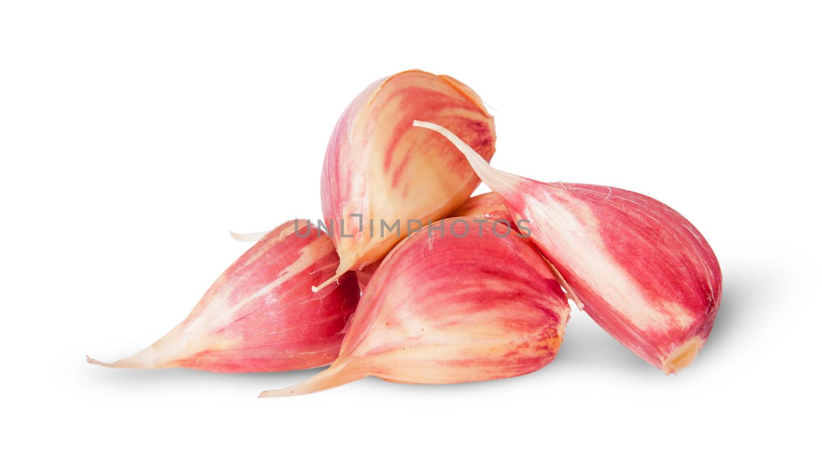 Pile garlic cloves isolated on white background