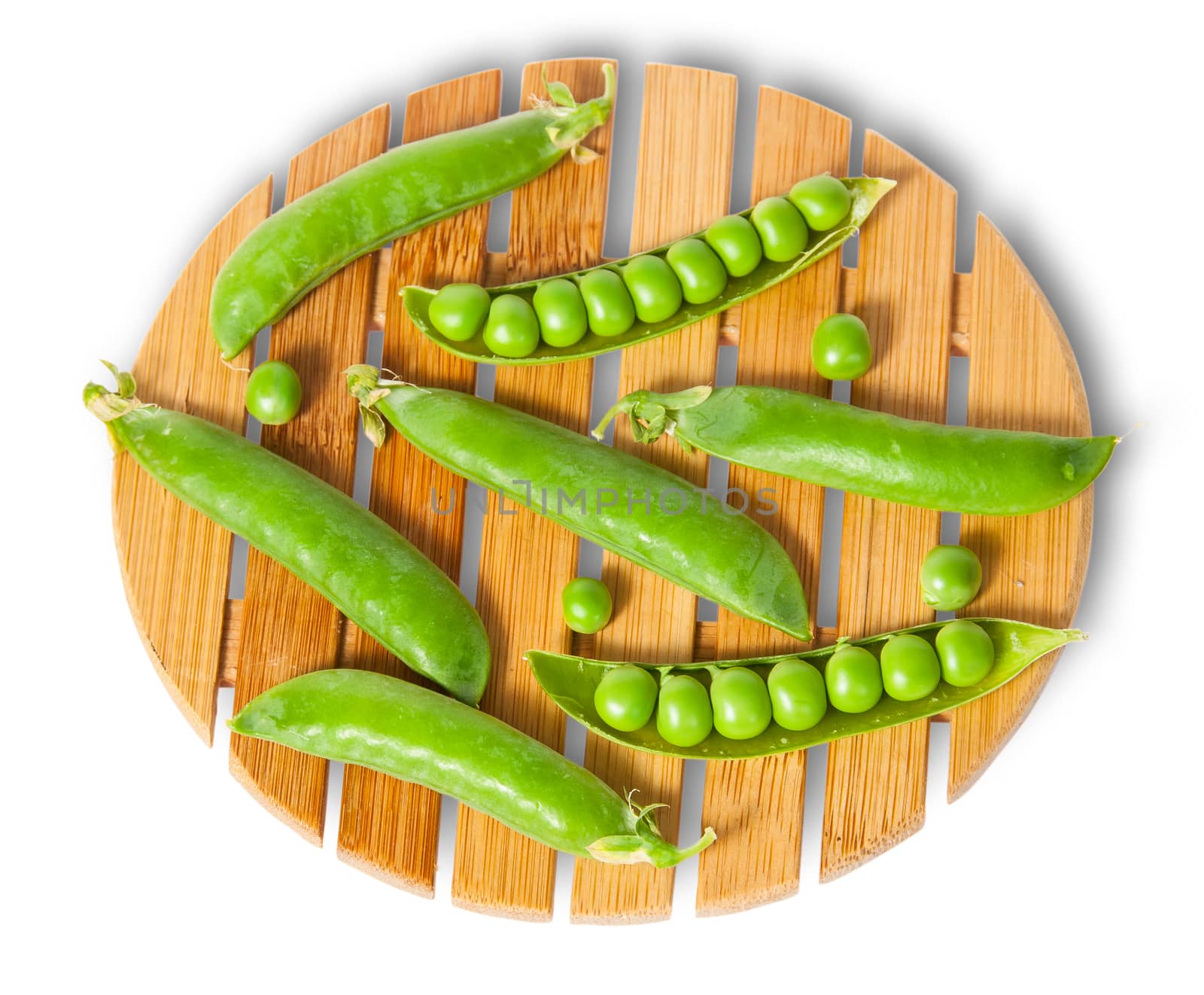 Pods of peas on bamboo board top and front view isolated on white background