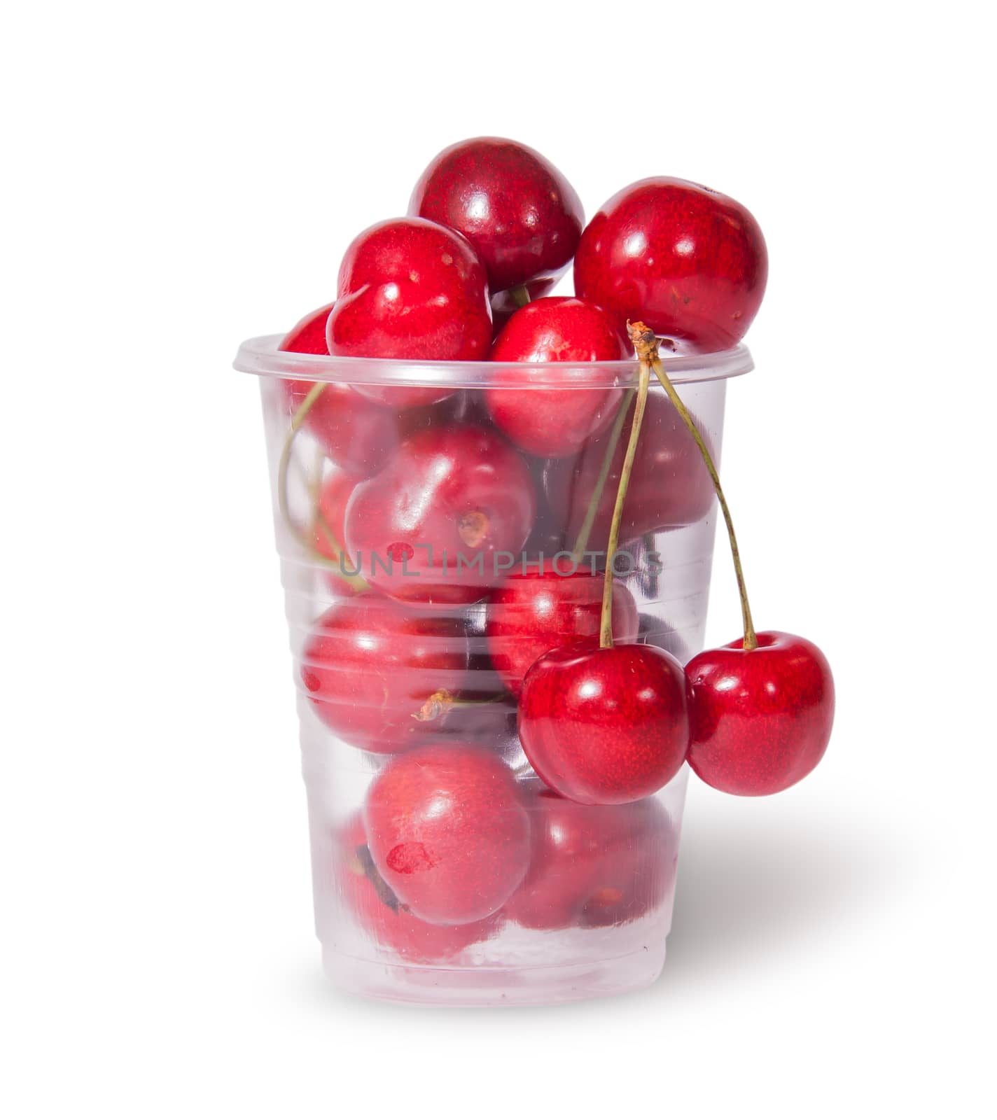 Red juicy sweet cherries in a plastic cup by Cipariss