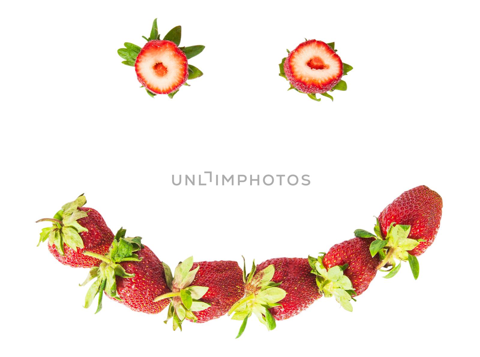 Smile of fresh juicy strawberries isolated on white background