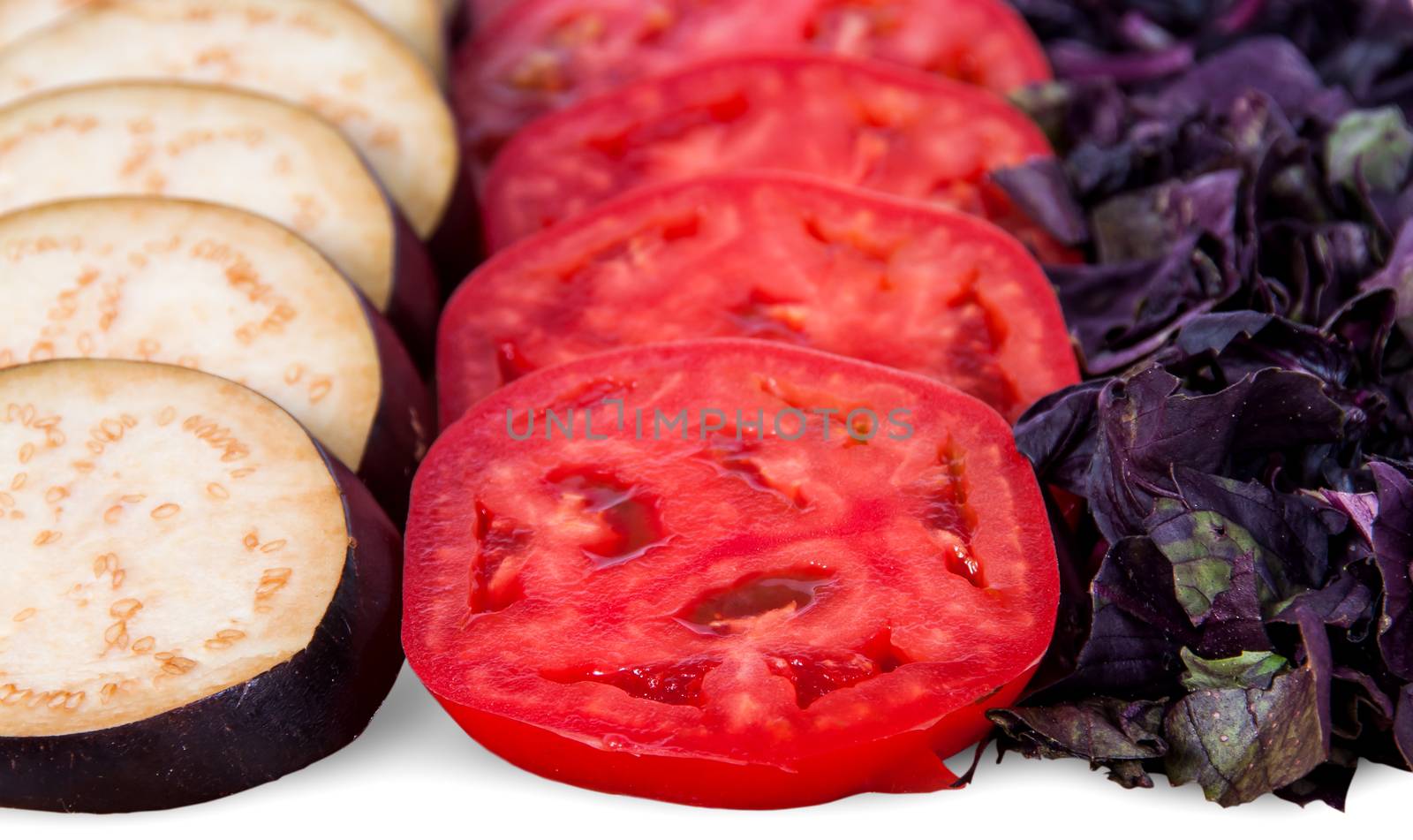 Sliced eggplant tomato and basil leaves isolated on white background