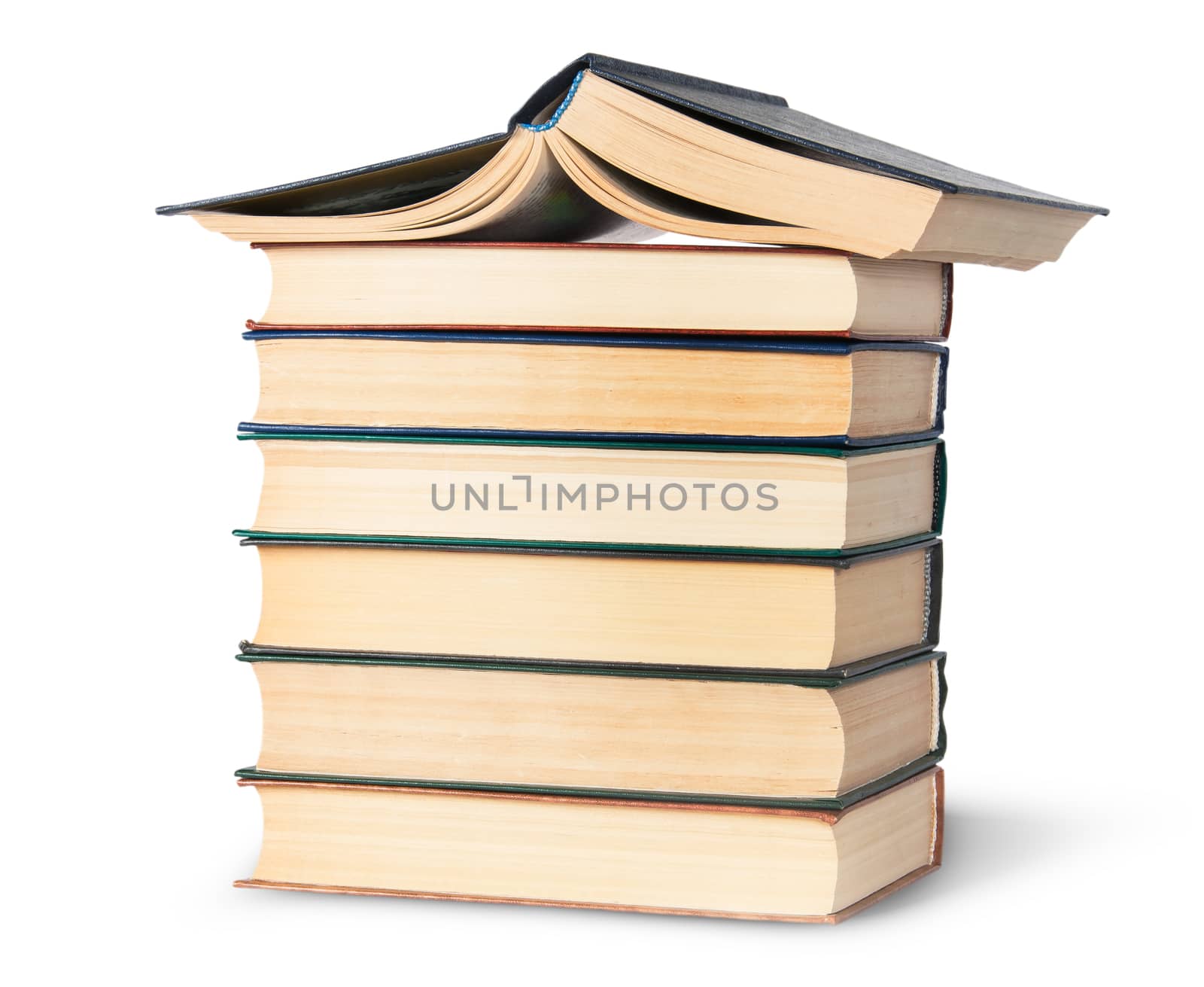 Stack of six old books with an open top rotated isolated on white background