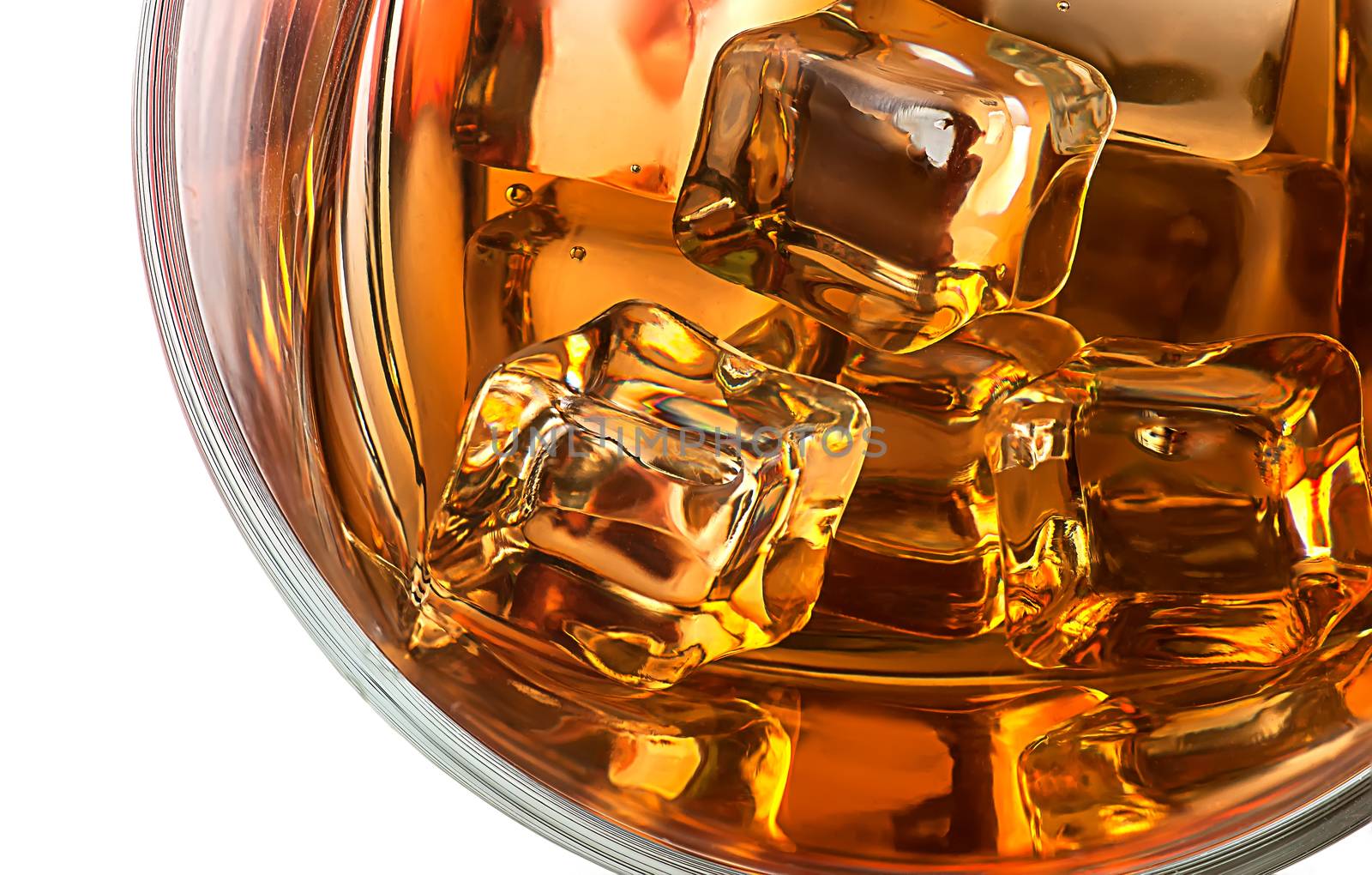 Top closeup of whiskey with ice isolated on white background
