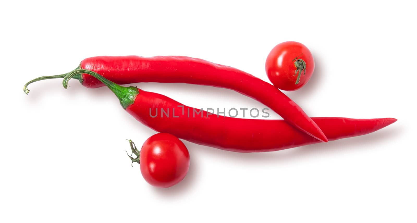 Two chili pepper and two cherry tomatoes top view isolated on white background