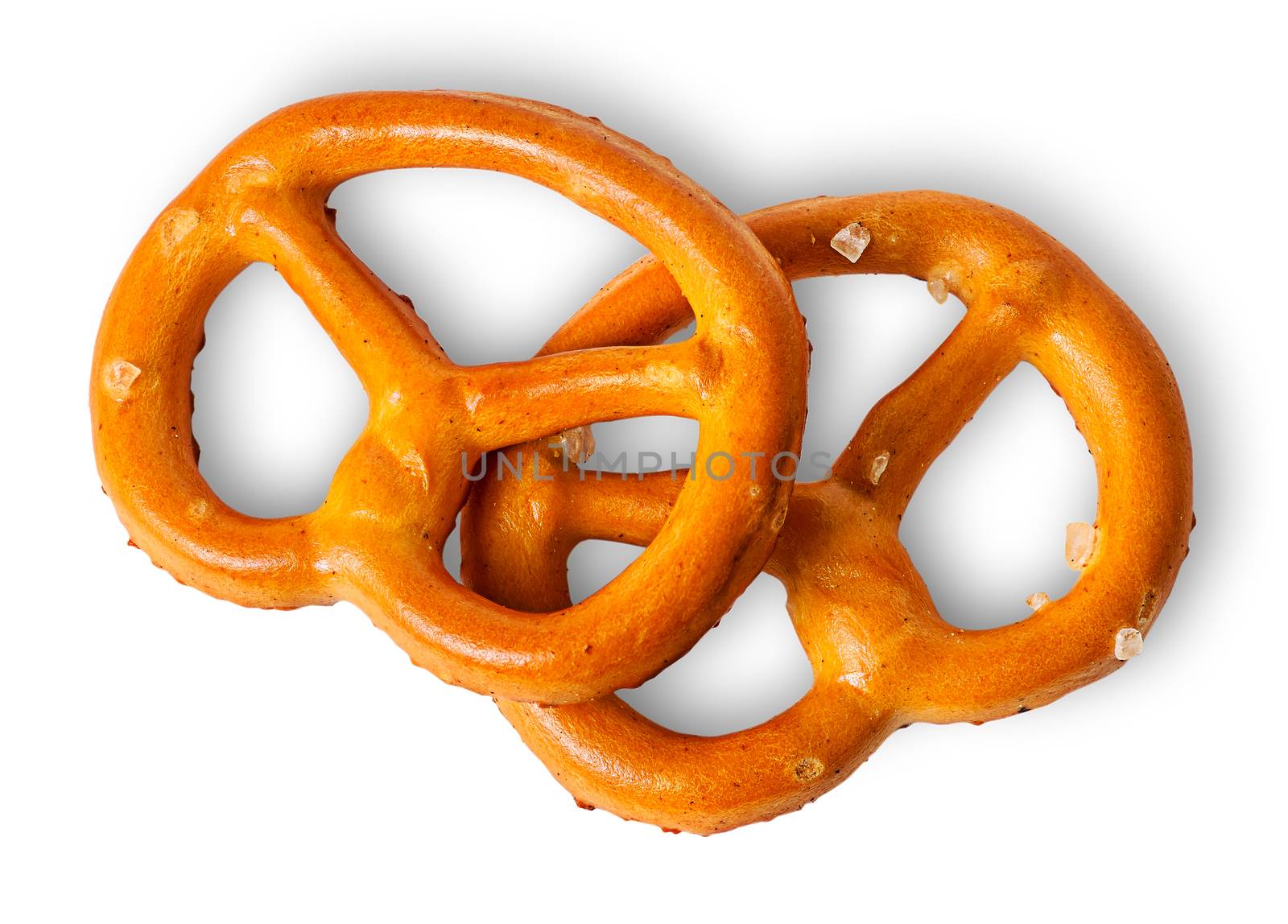 Two crunchy pretzels with salt on each other by Cipariss