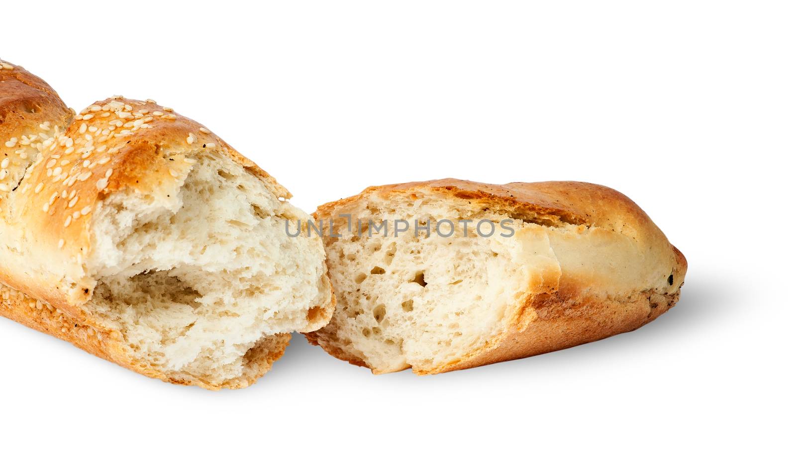 Two fresh French baguette piece isolated on white background