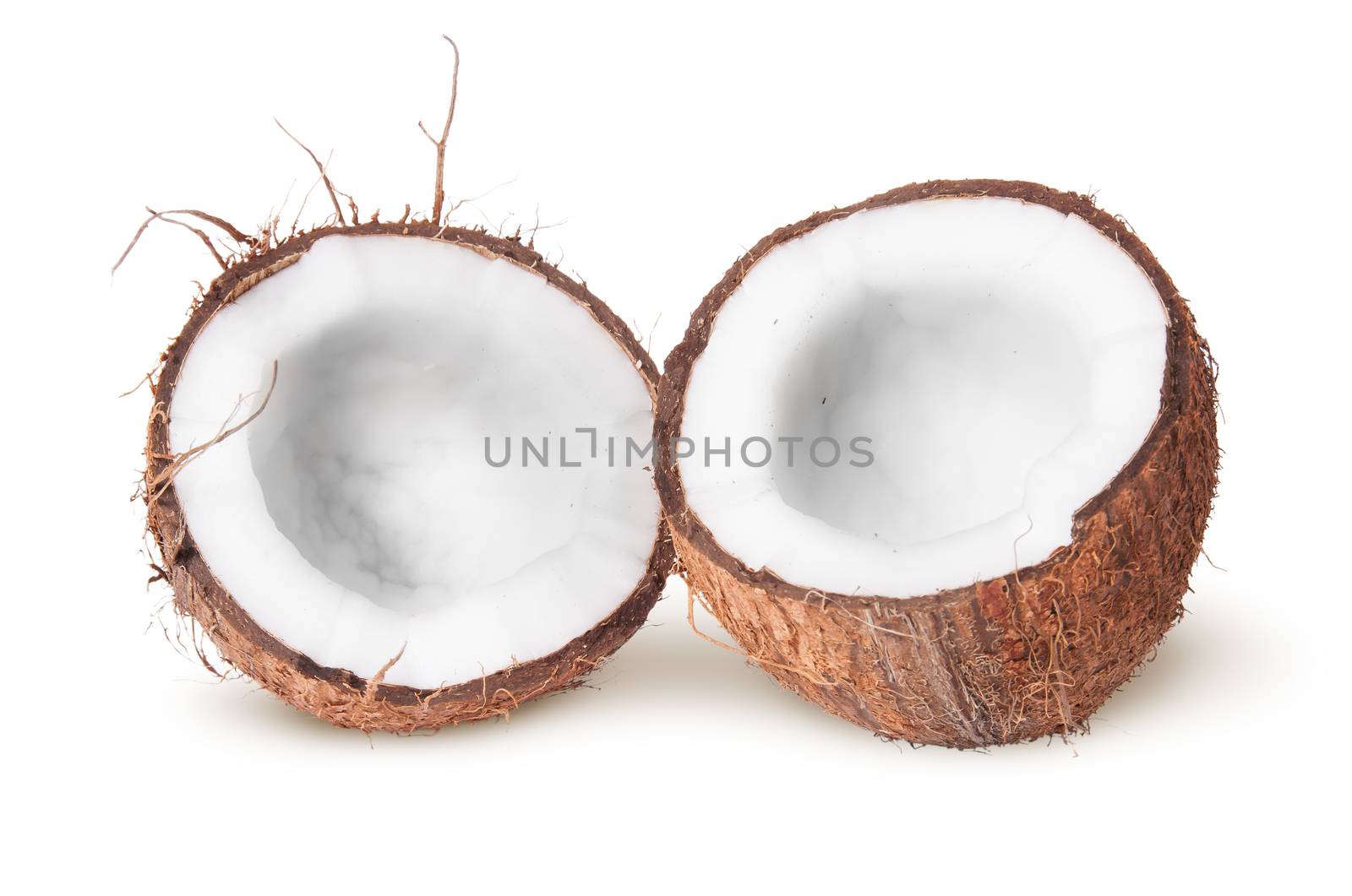 Two halves of coconut lying next by Cipariss
