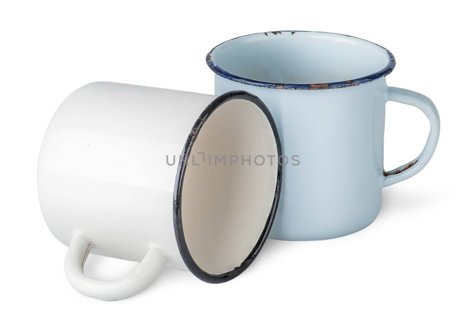 Two old enameled mugs beside isolated on white background