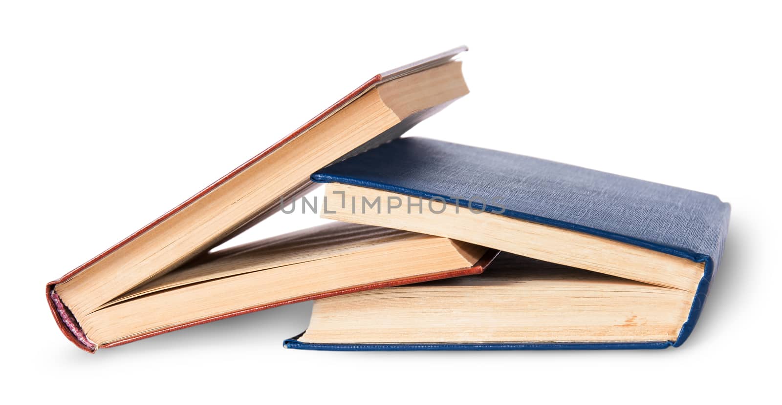 Two old books imbedded in one another rotated isolated on white background