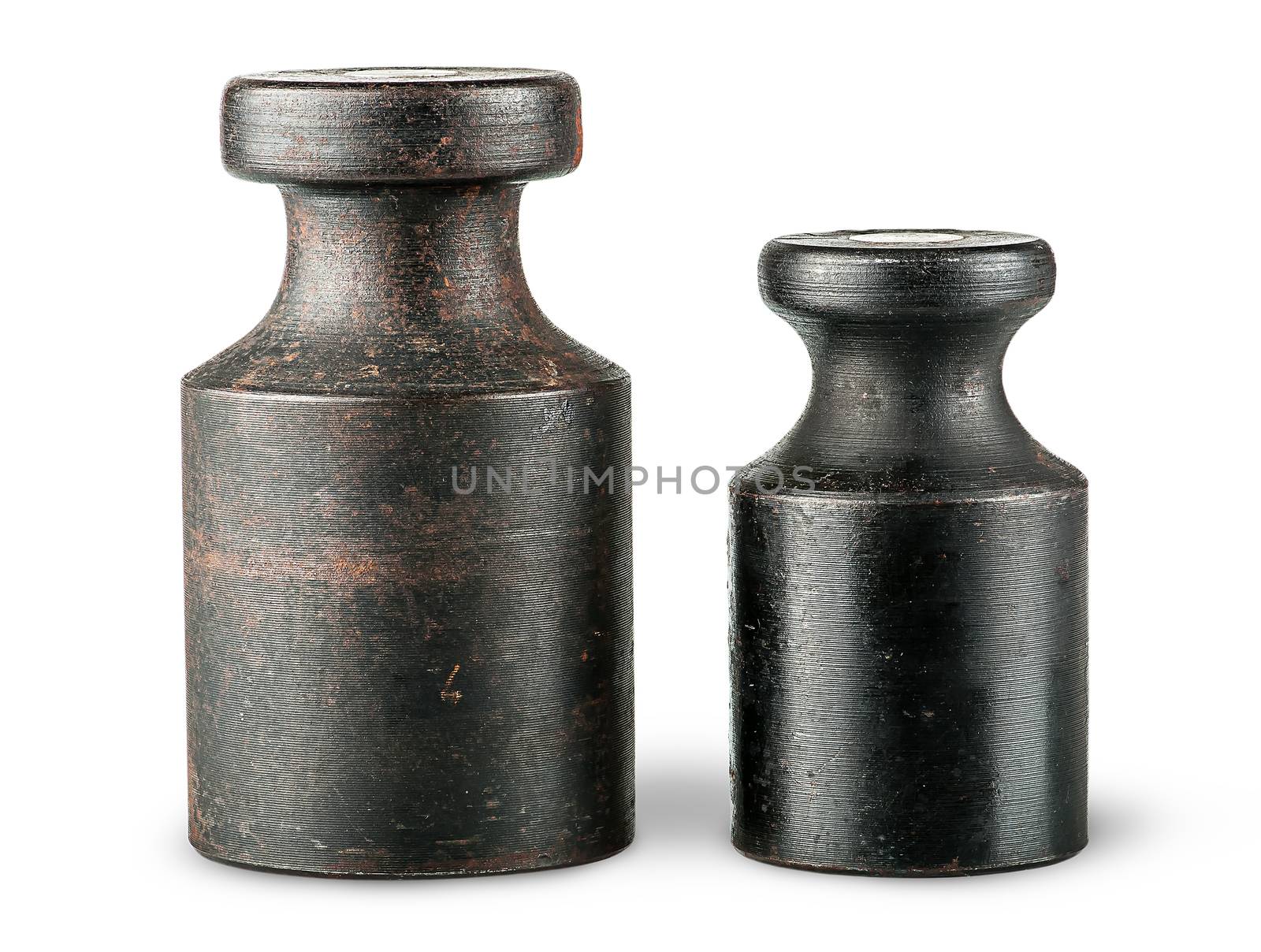 Two old rusty scale weights isolated on white background