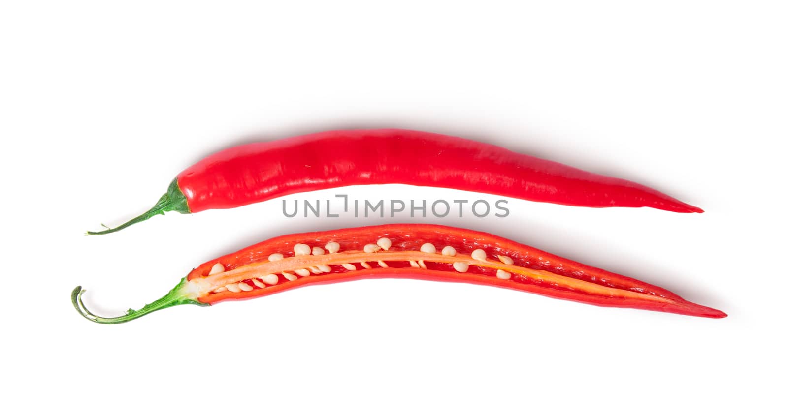 Two inverted halves of red chili peppers by Cipariss