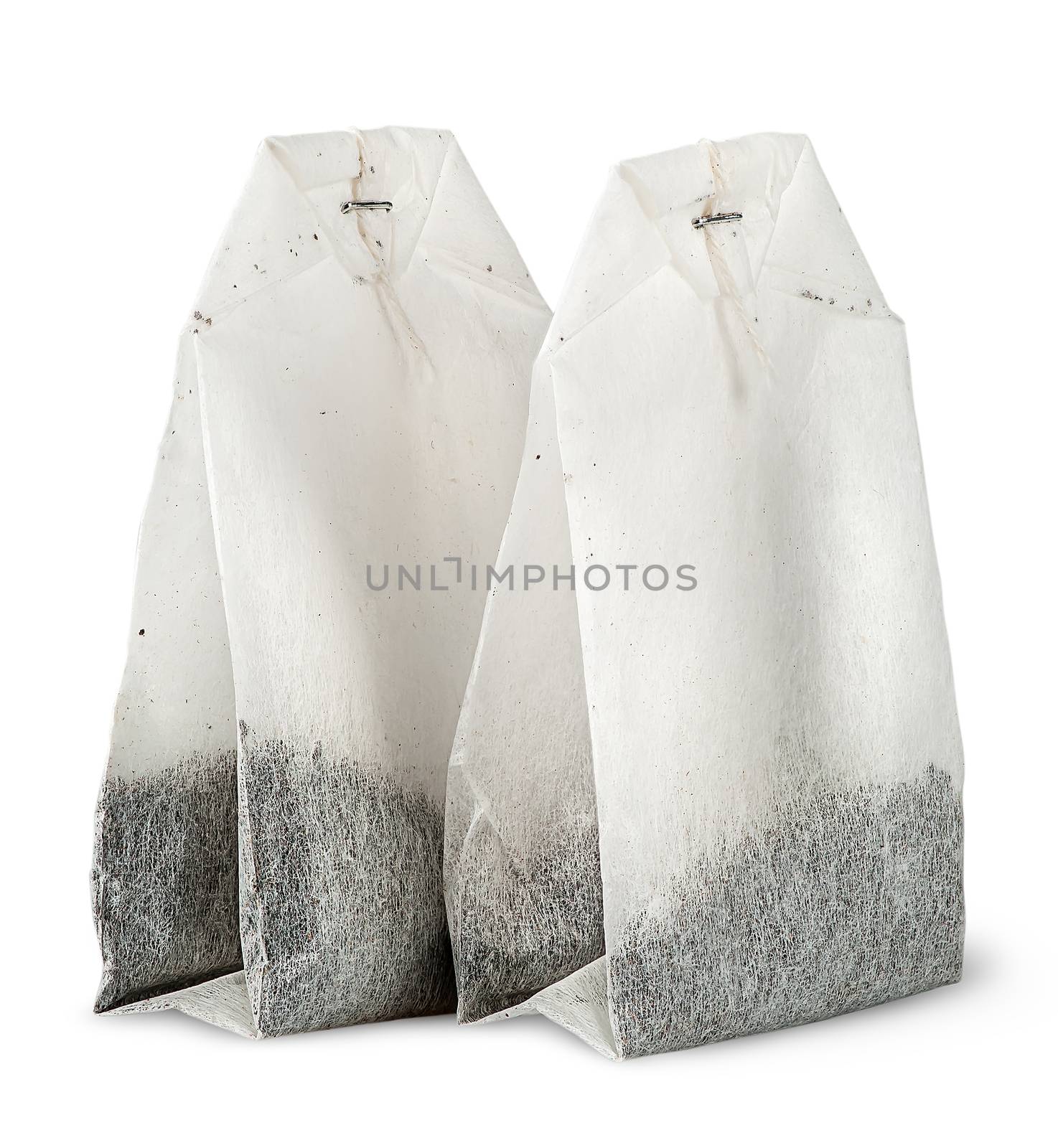 Two tea bags each other isolated on white background