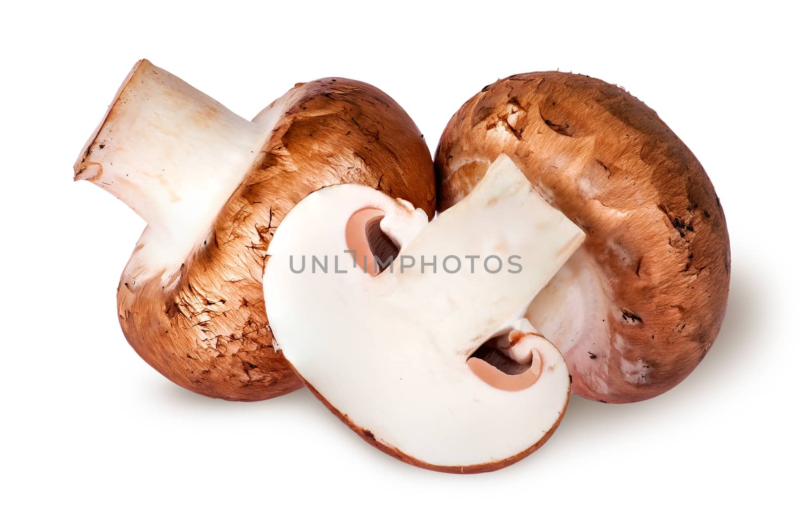 Two whole and half brown champignons isolated on white background