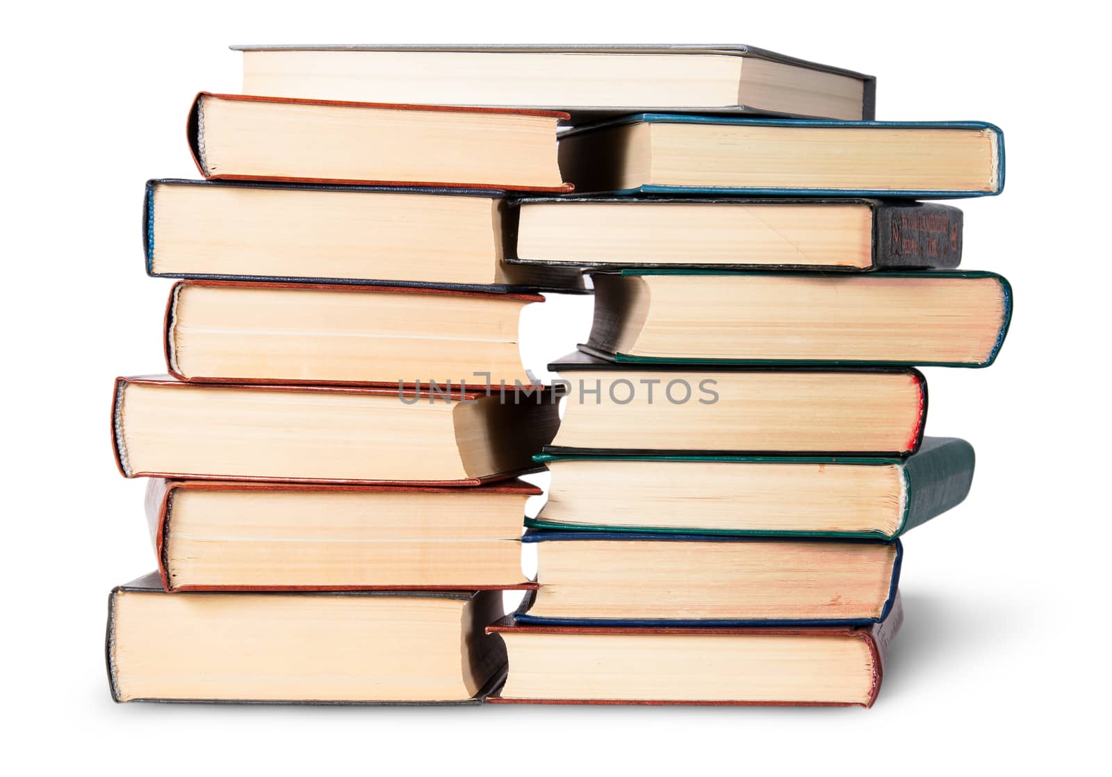 Two stacks chaotically stacked old books isolated on white background