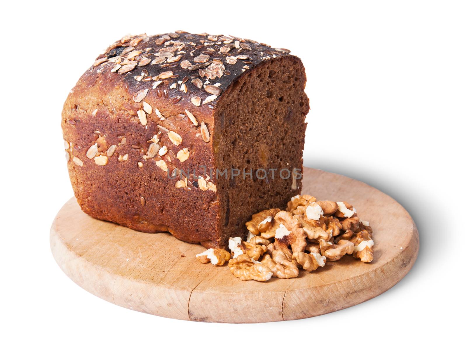 Unleavened bread with seeds on wooden board with nuts isolated on white background