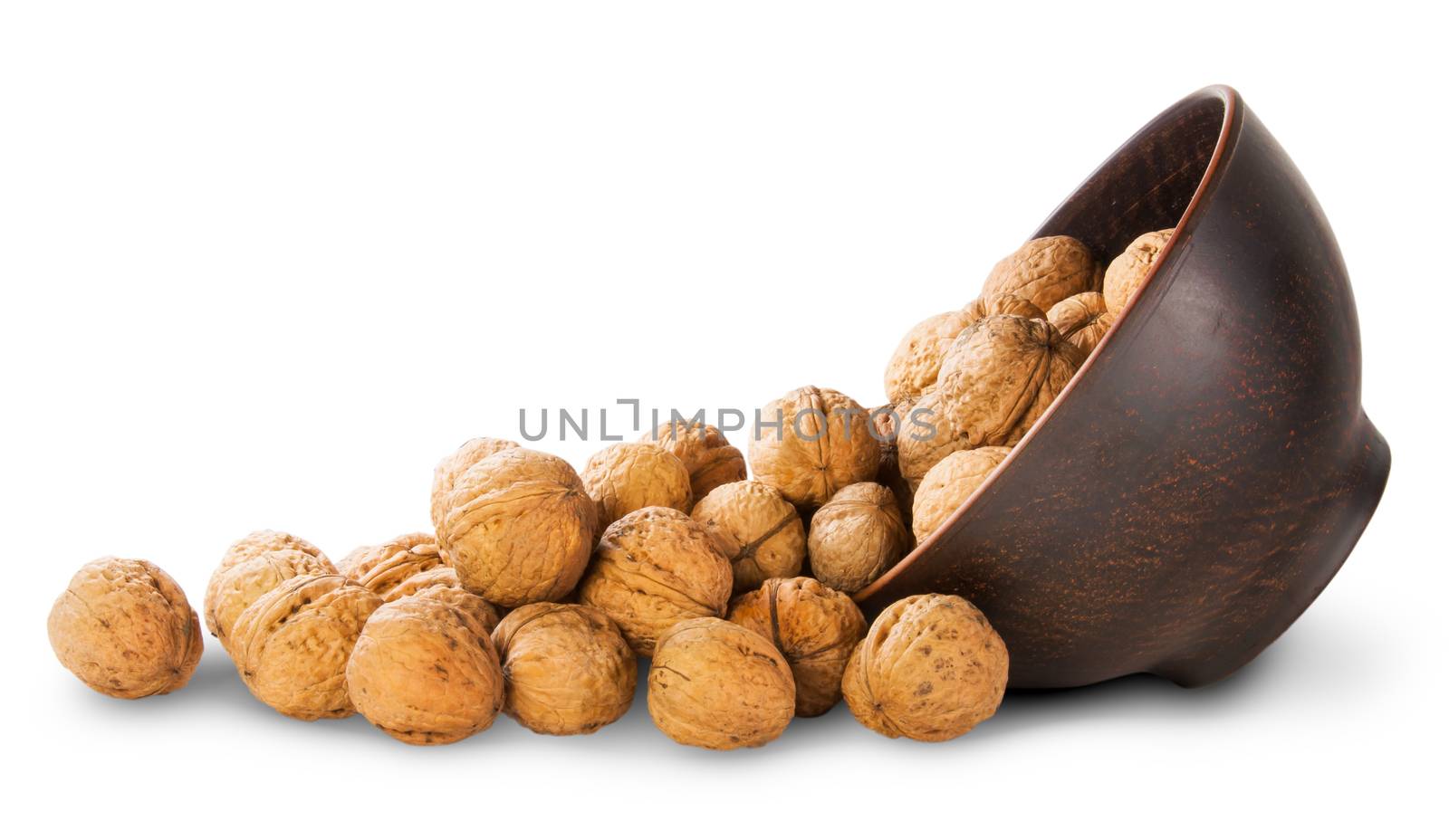 Walnuts Spill Out Of A Clay Bowl by Cipariss