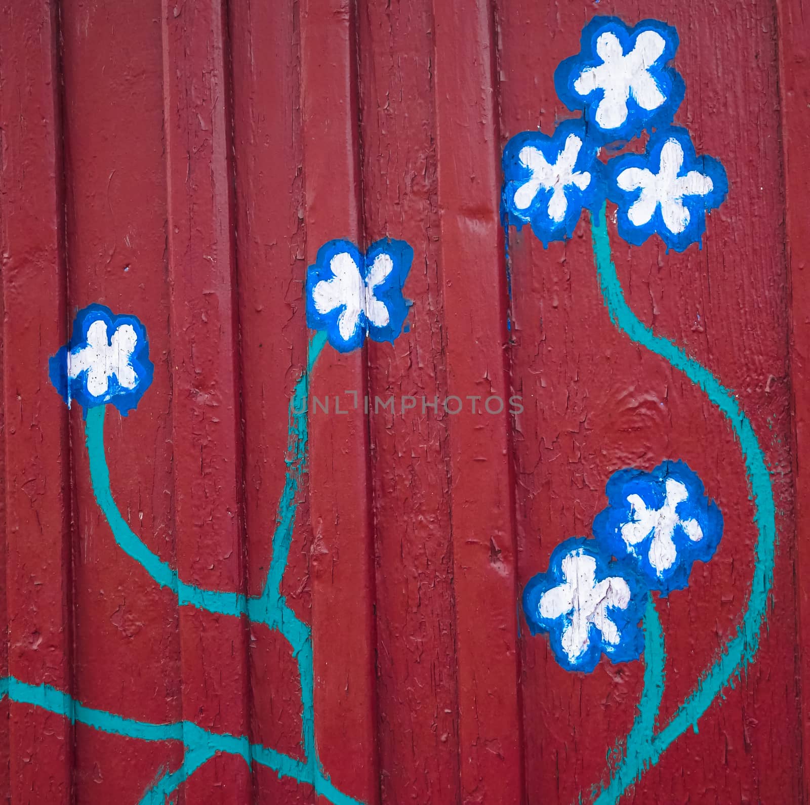 the background of painted flowers on red wall