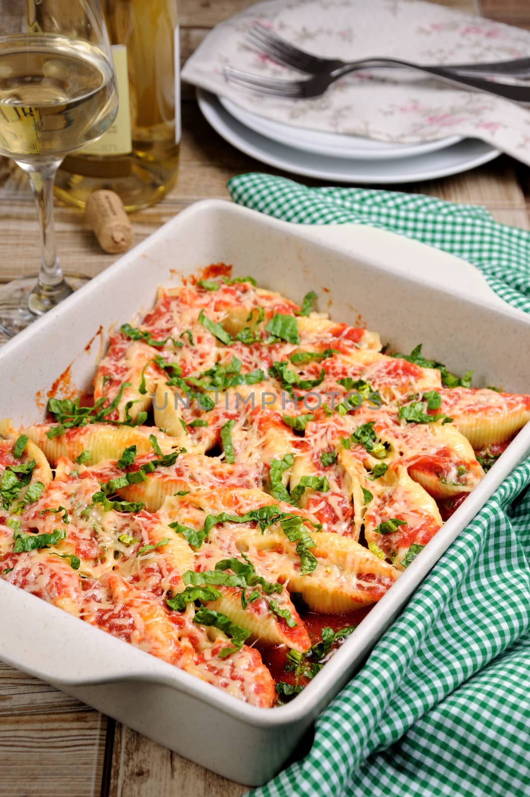 pasta conchiglioni shells stuffed meat mince with spinach and tomato sauce , Parmesan cheese. 