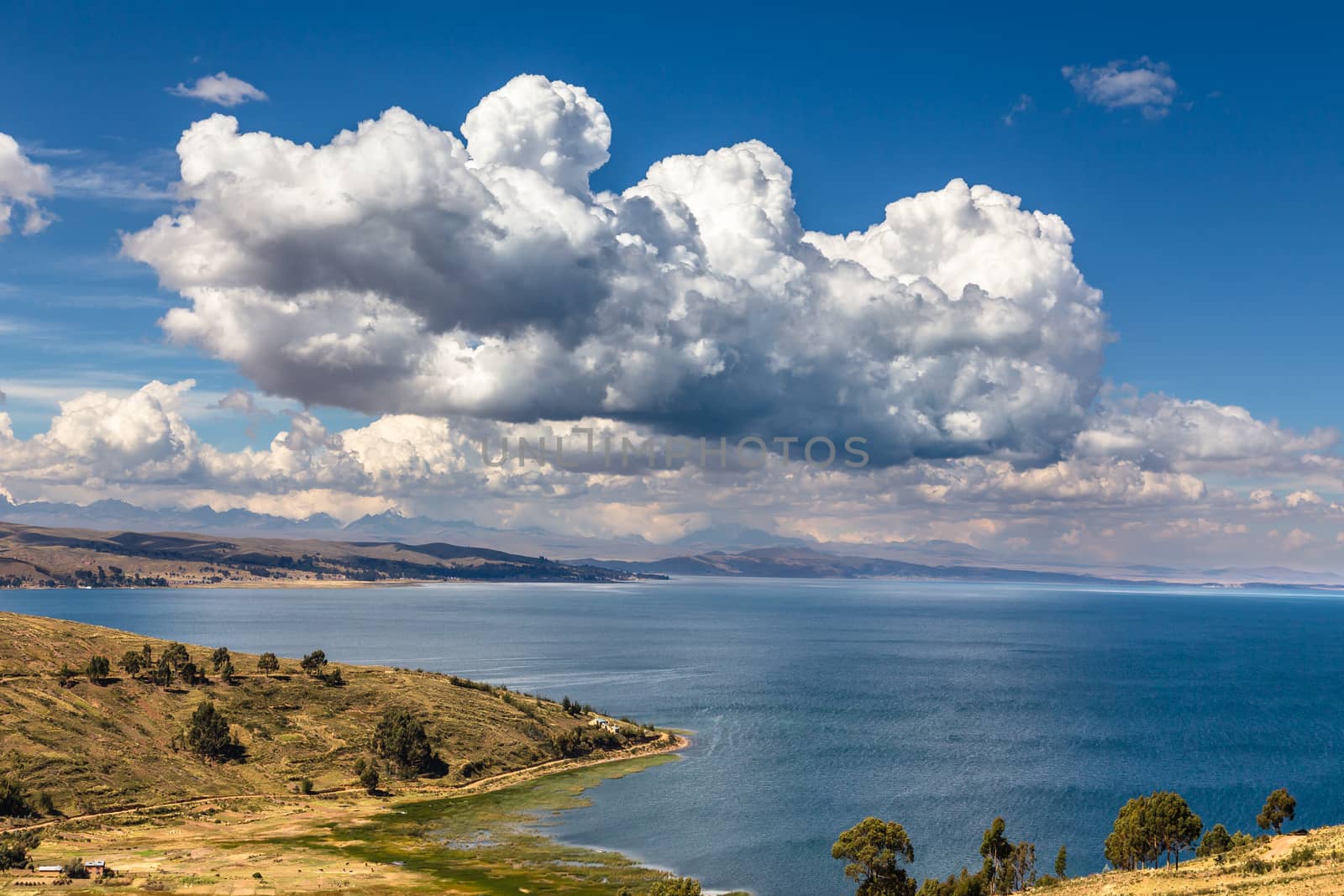 Clouds over the coastline of Titicaca lake, Bolivia