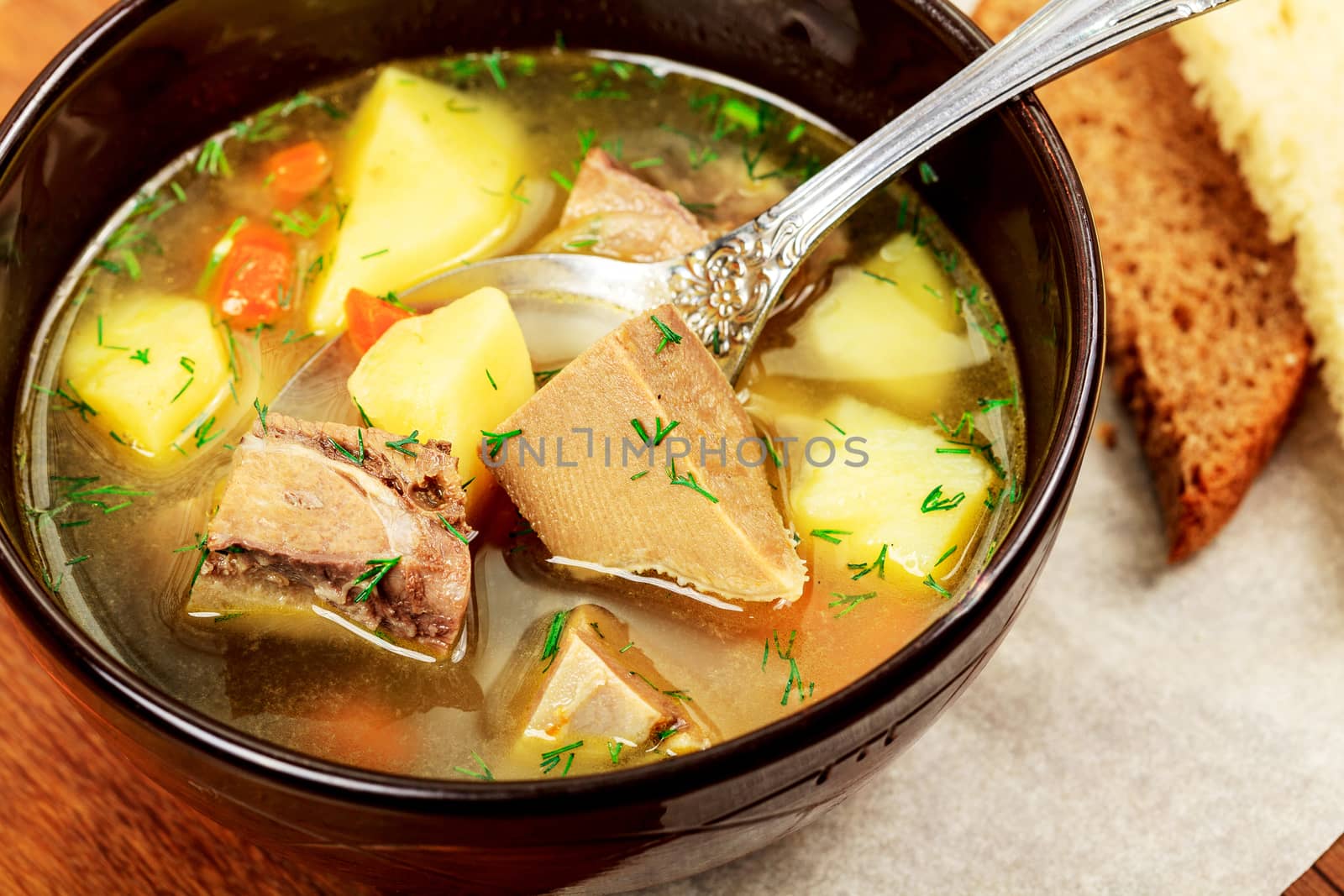 Plate of vegetable soup with meat