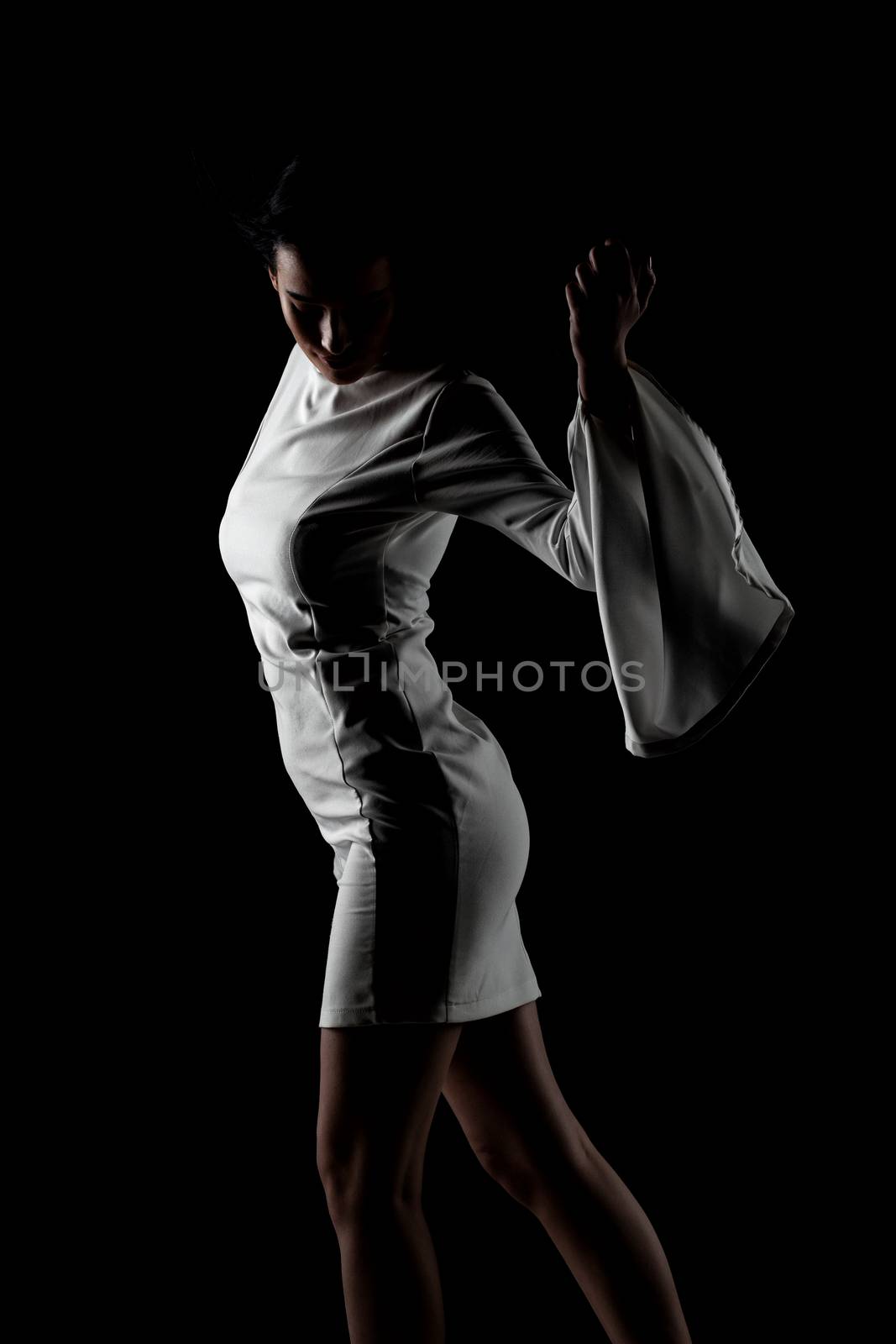 beautiful black haired lady in a white dress