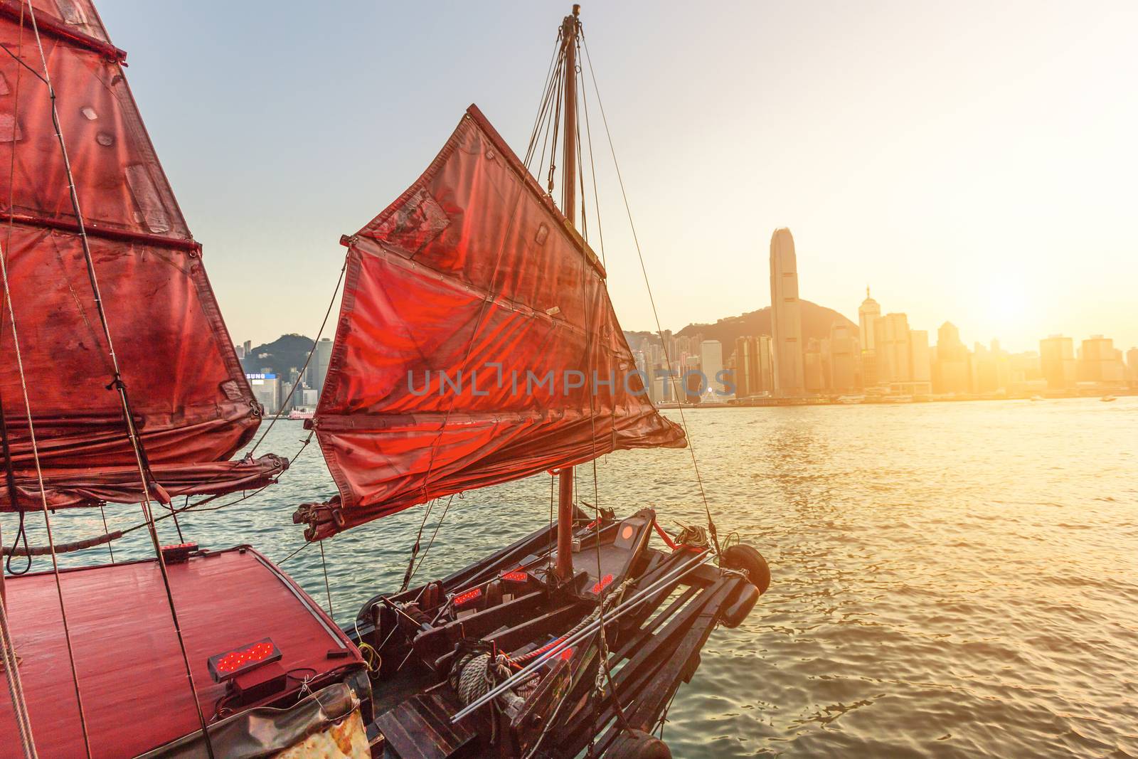 Sailboat In Hong Kong Harbour at sunset.