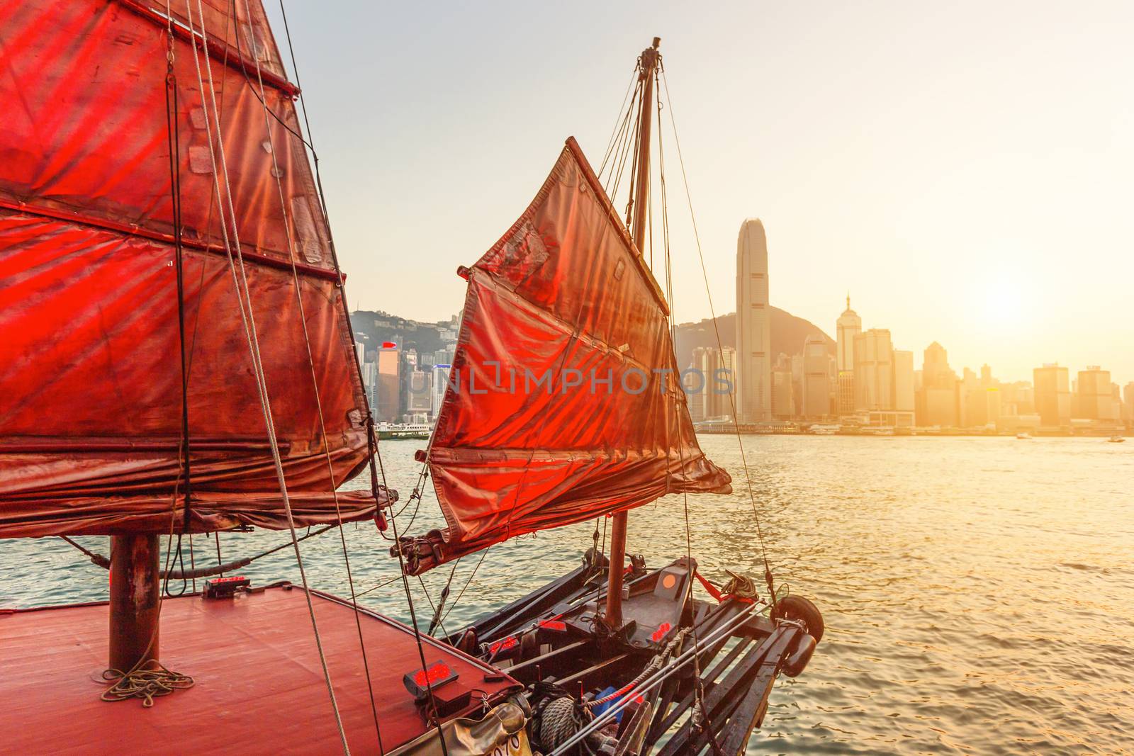 Sailboat In Hong Kong Harbour at sunset.