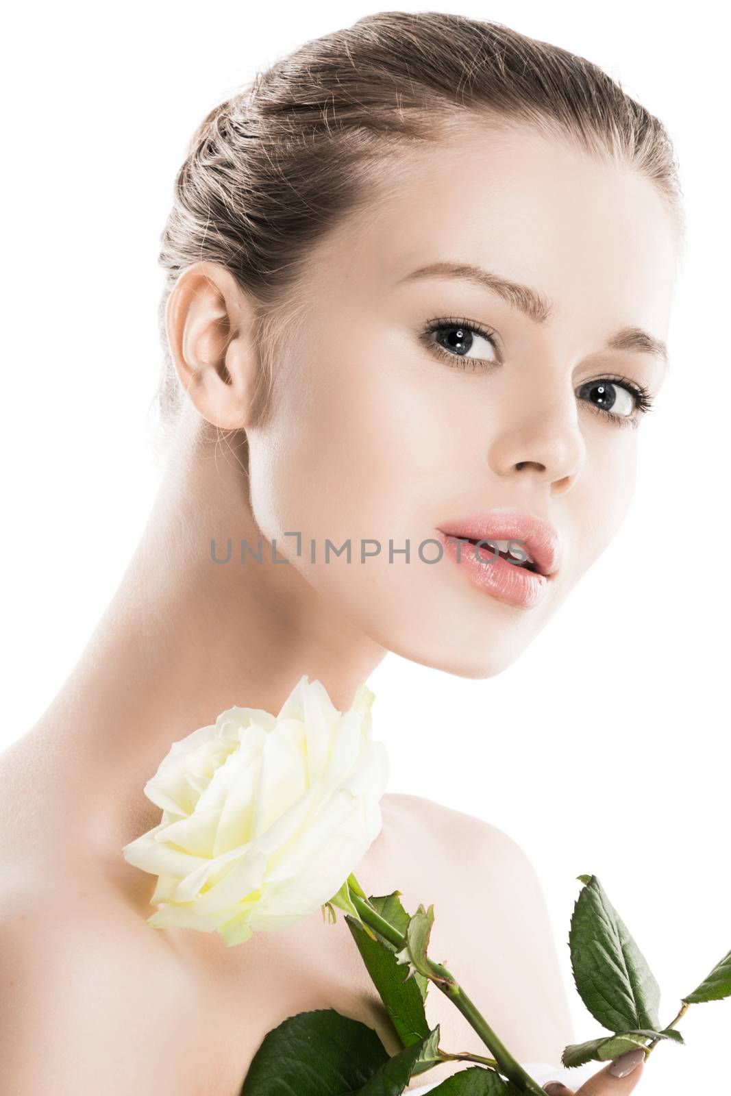 Beautiful young nude woman with white rose close up isolated on white background