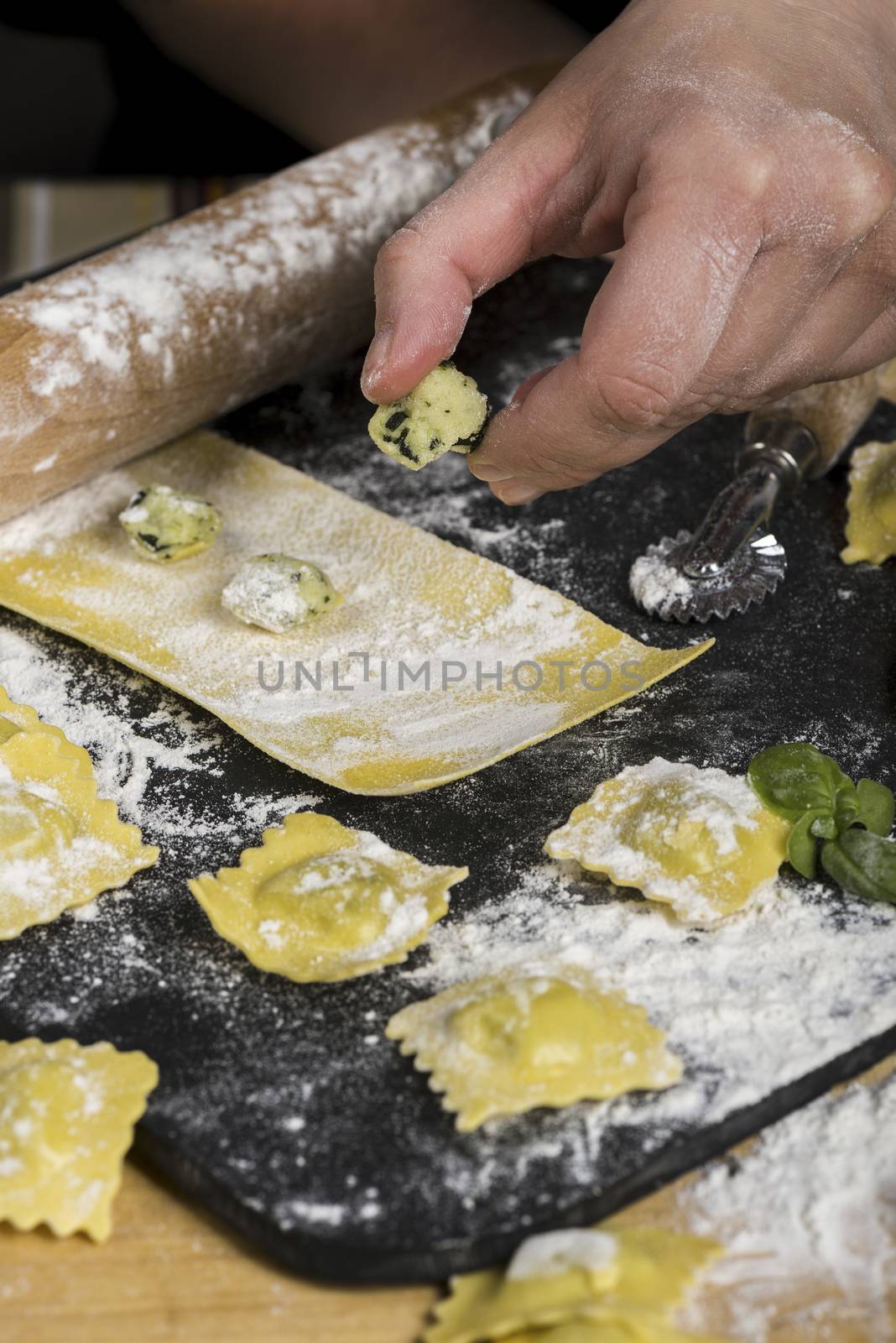 making ravioli, cutting the dough, stuffing the italian pasta by verbano
