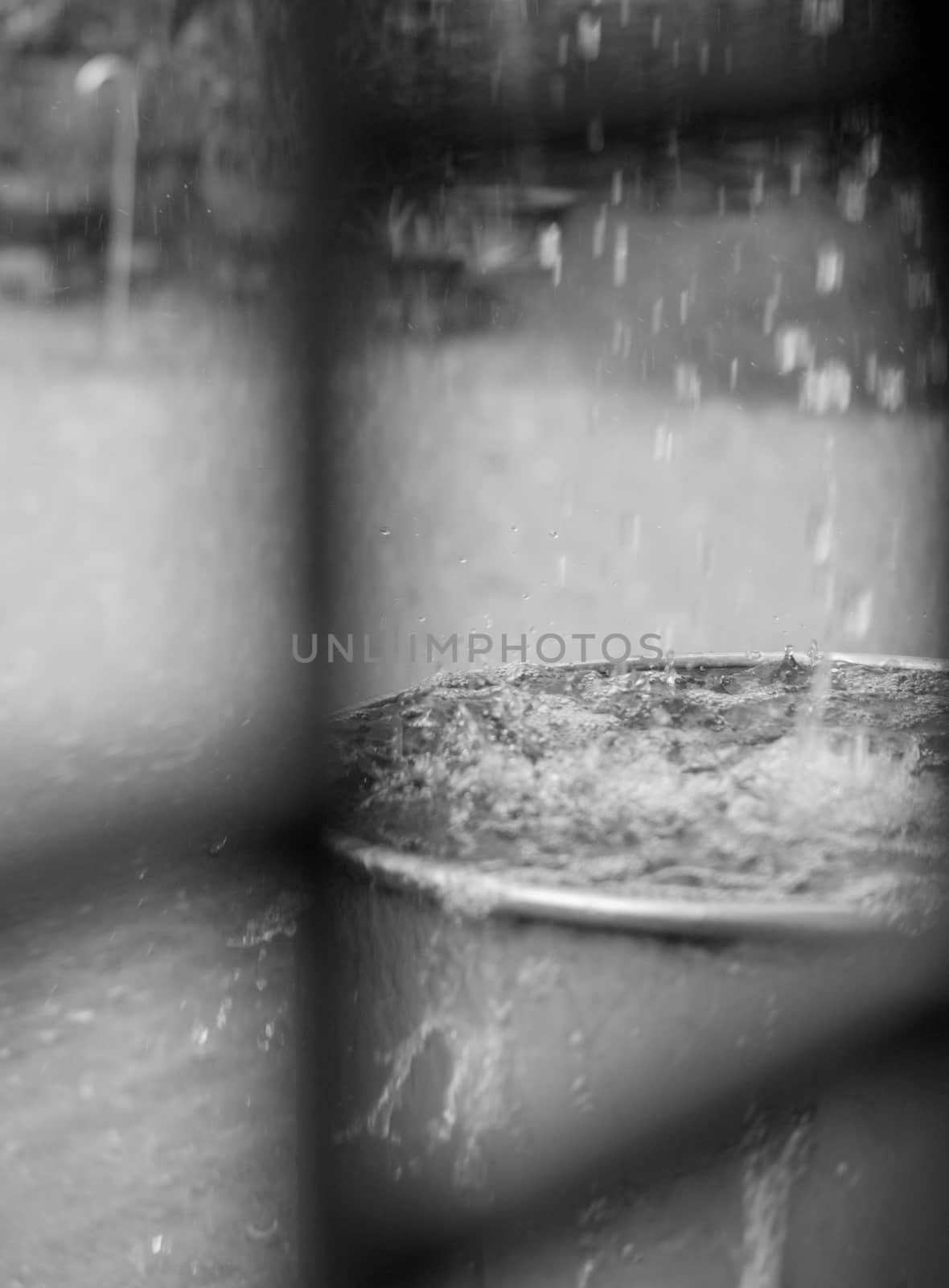 RAIN DROPS FALLING INTO STEEL TANK by PrettyTG
