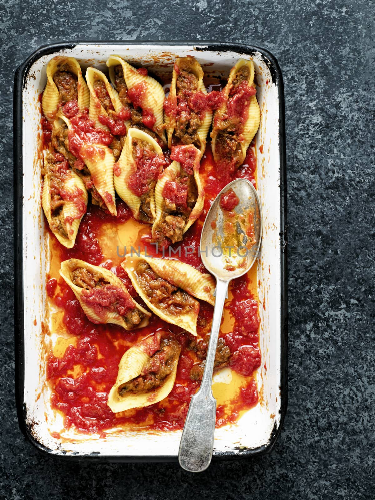 close up of rustic italian stuffed conchiglie pasta