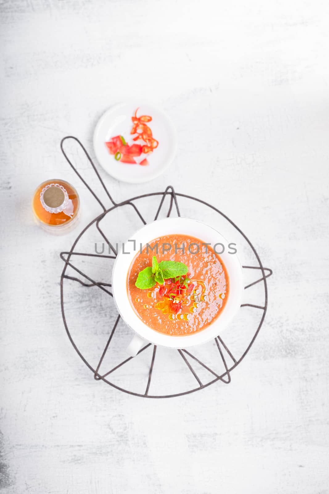 Bowl of Fresh tomato soup Gazpacho on a white background.