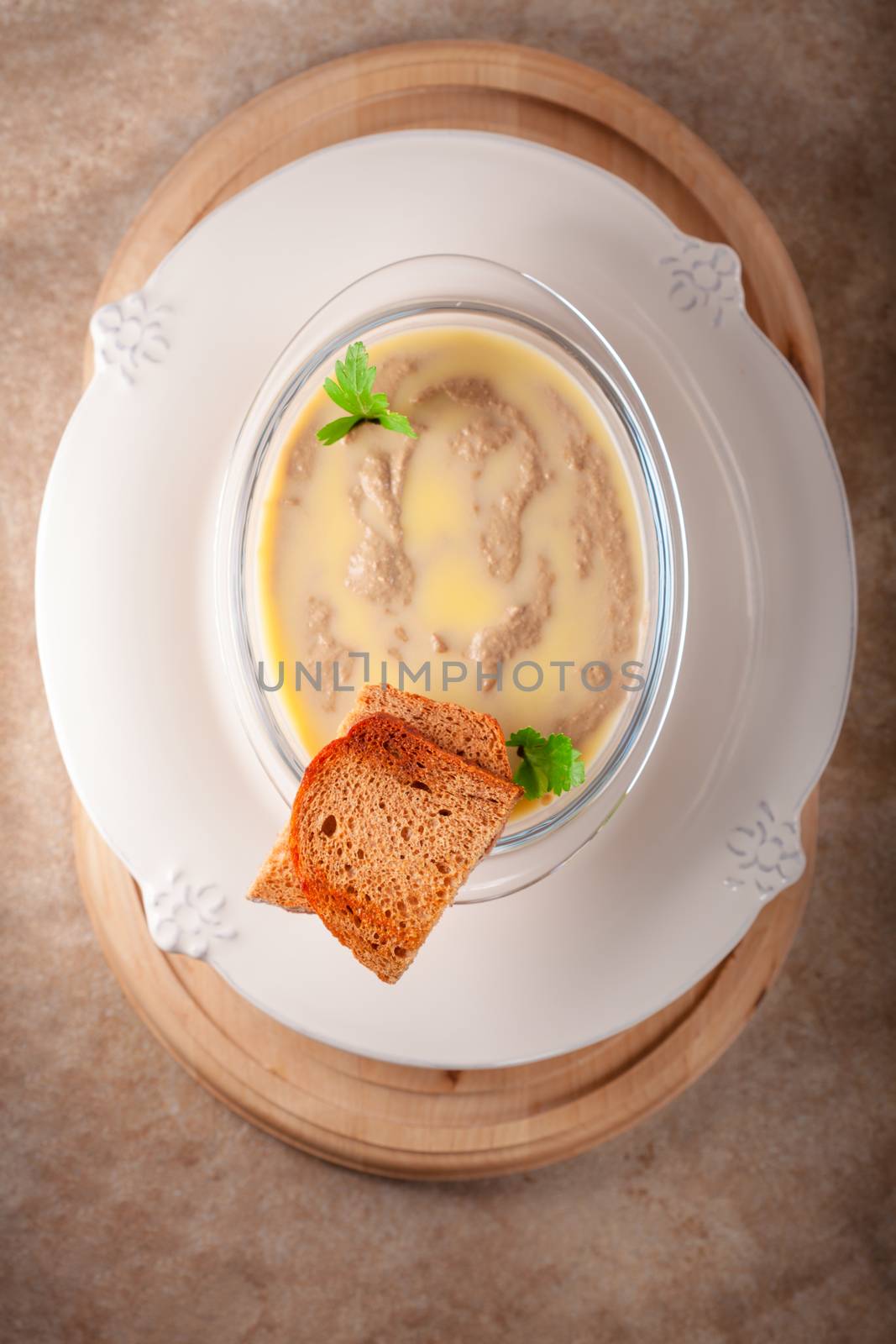 Home made chicken liver pate on a ceramic surface