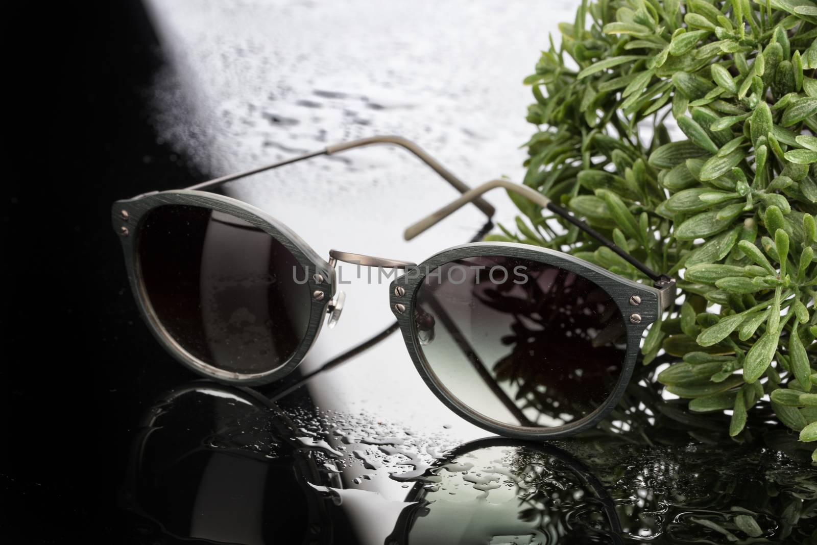 Sunglasses on a studio glass background
