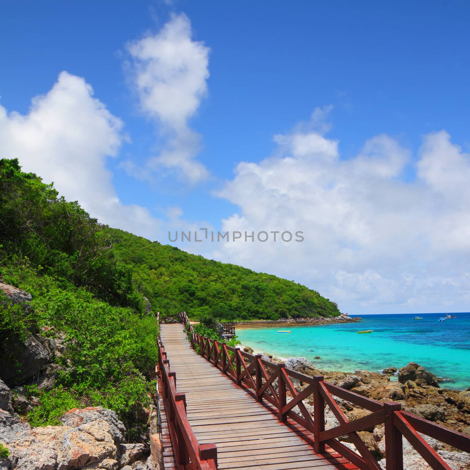 jetty to a tropical beach on island with blue sky, at koh lan island Pattaya city Chonburi Thailand