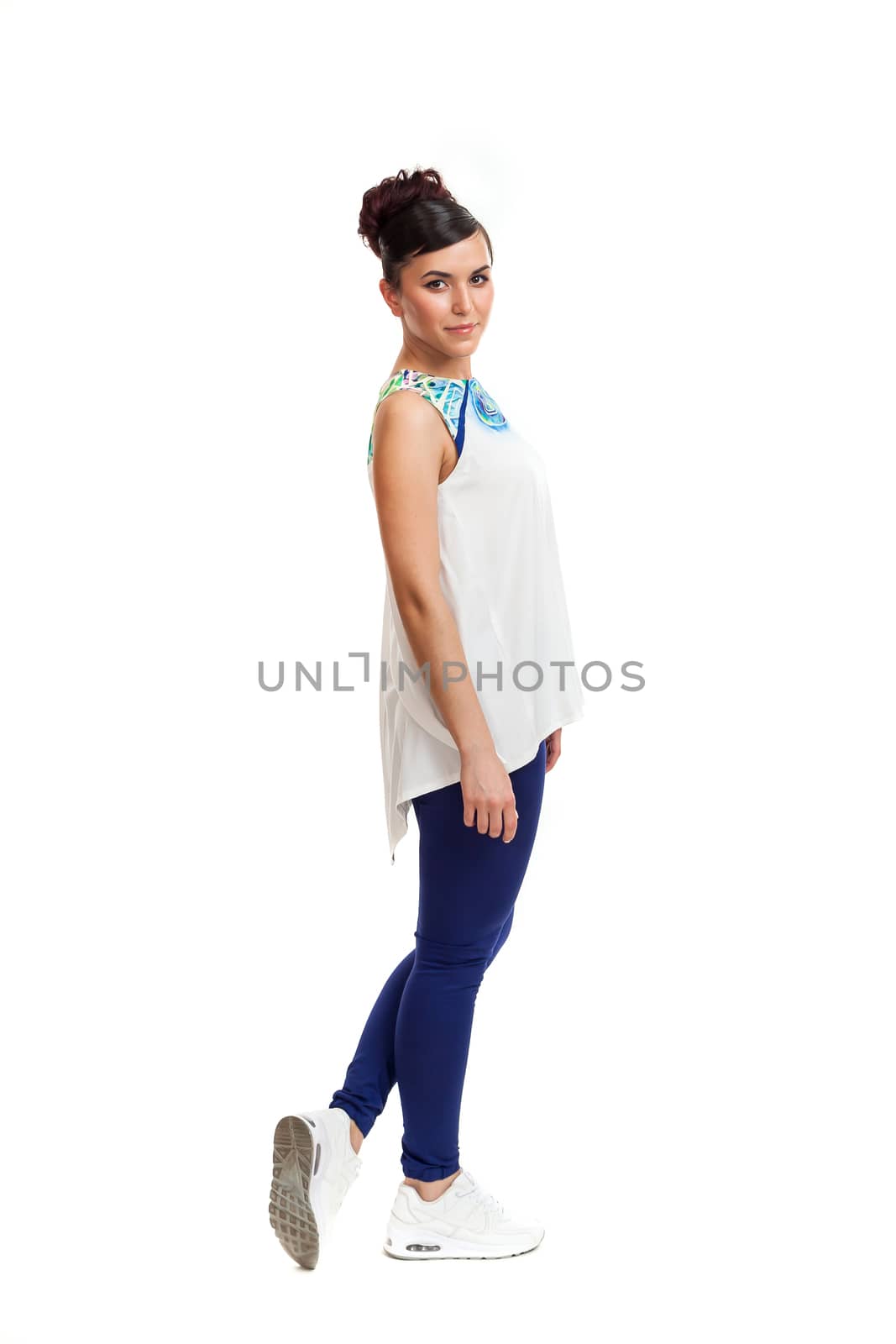 the young woman in convenient clothes on a white background