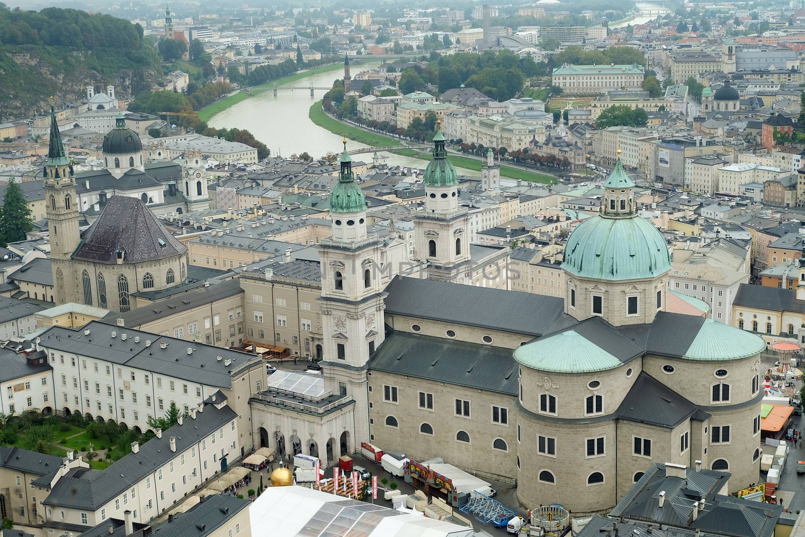 Horizontal panoramic view of the center of city Salzburg with Franciscan Church, Salzburg Cathedral and Salzach river, Austria